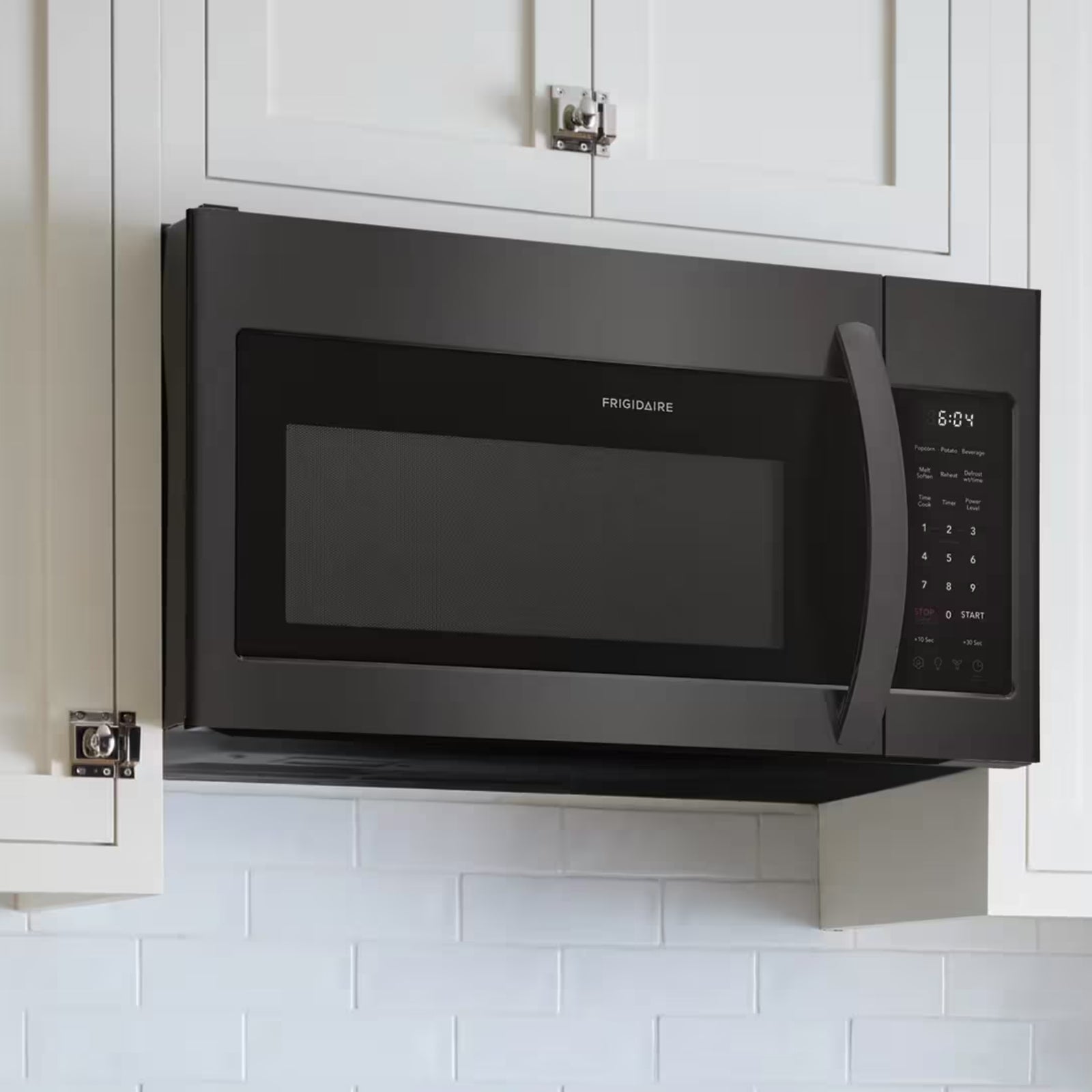 Frigidaire FMOS1846BD 1.8 cu ft black stainless steel over-the-range microwave showing the front control panel
