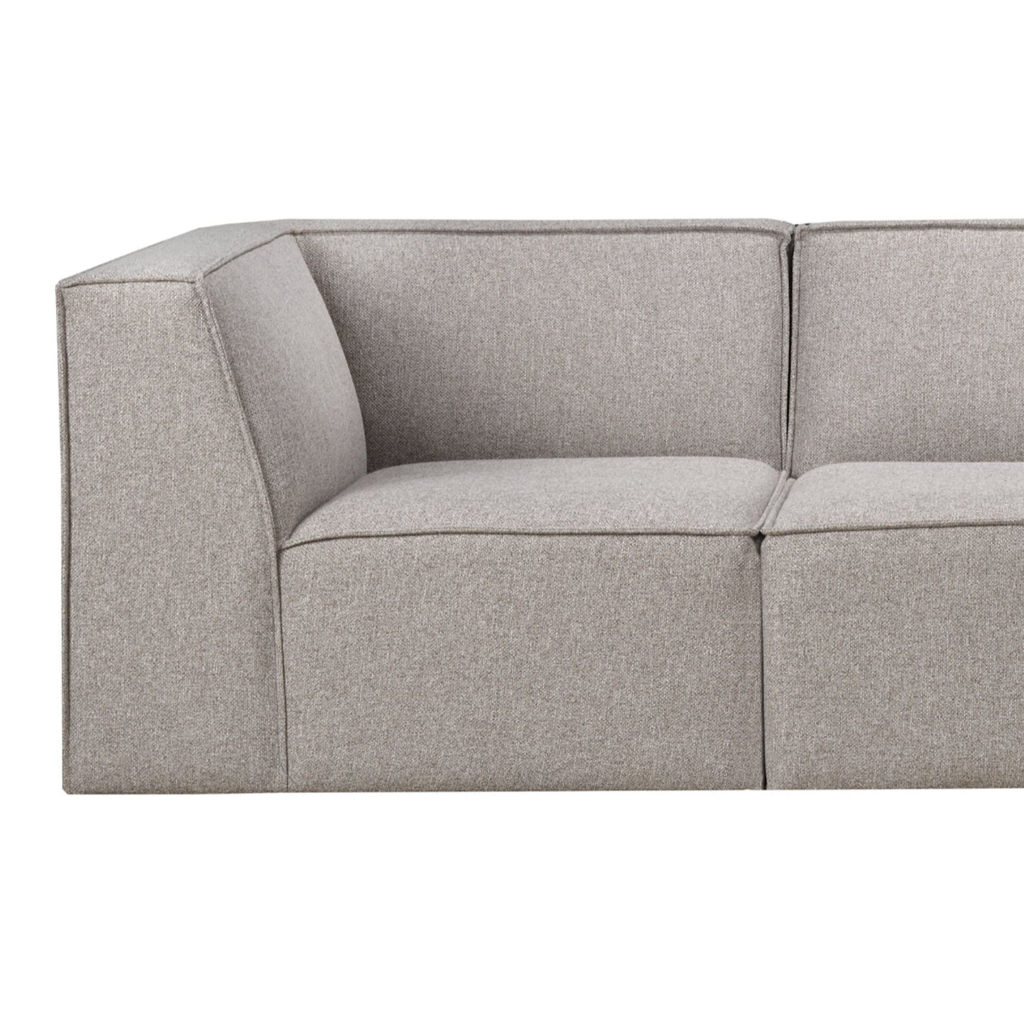 Steel grey Flare Sectional Sofa from Statum Designs Inc, showcasing its modern design and spacious seating in a stylish living room.