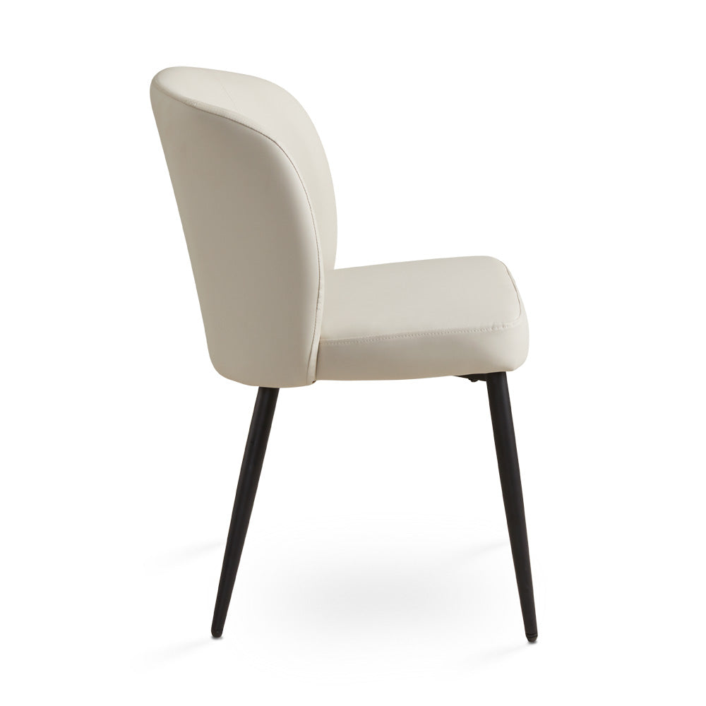 Side view of Ella + Ross Divya dining chair with taupe PU upholstery and black metal legs.