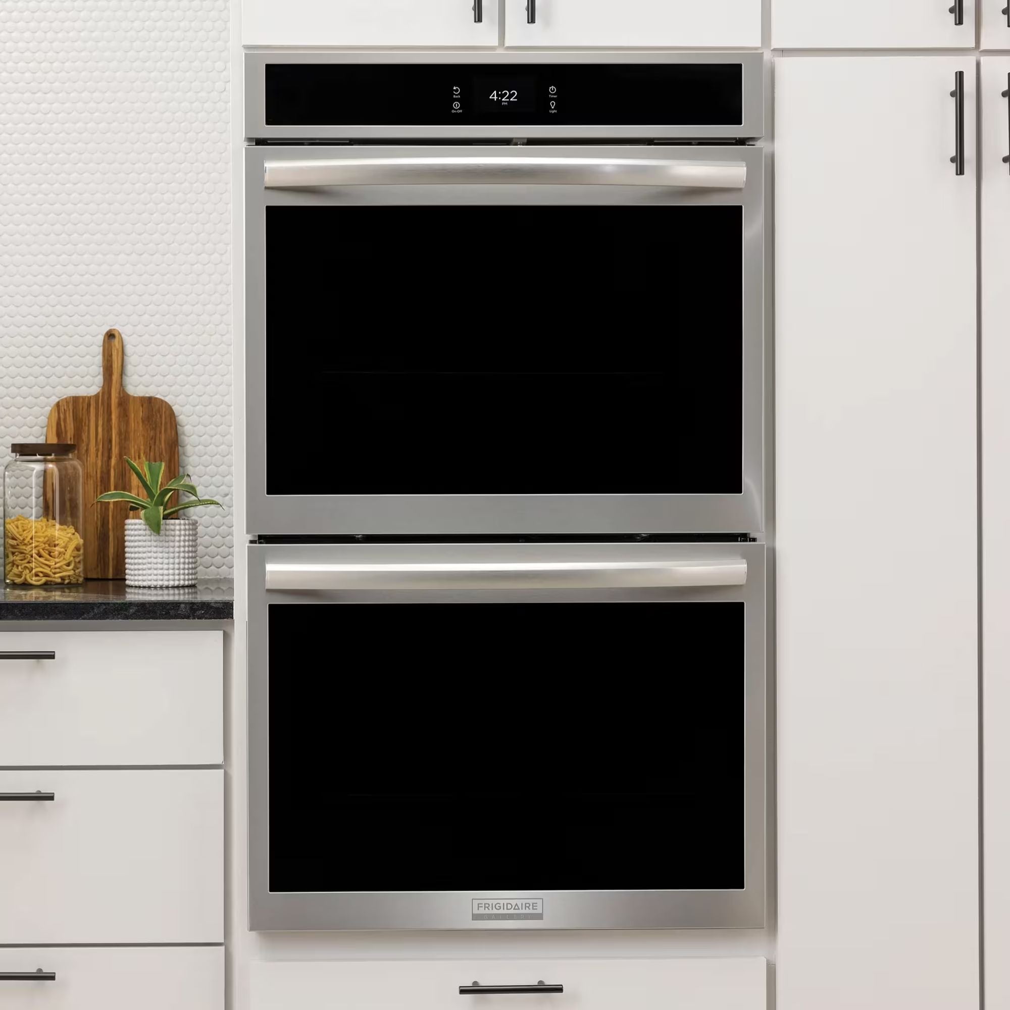 Frigidaire Gallery 30-inch double electric wall oven with stainless steel finish and stone-baked pizza setting, shown with oven doors open.