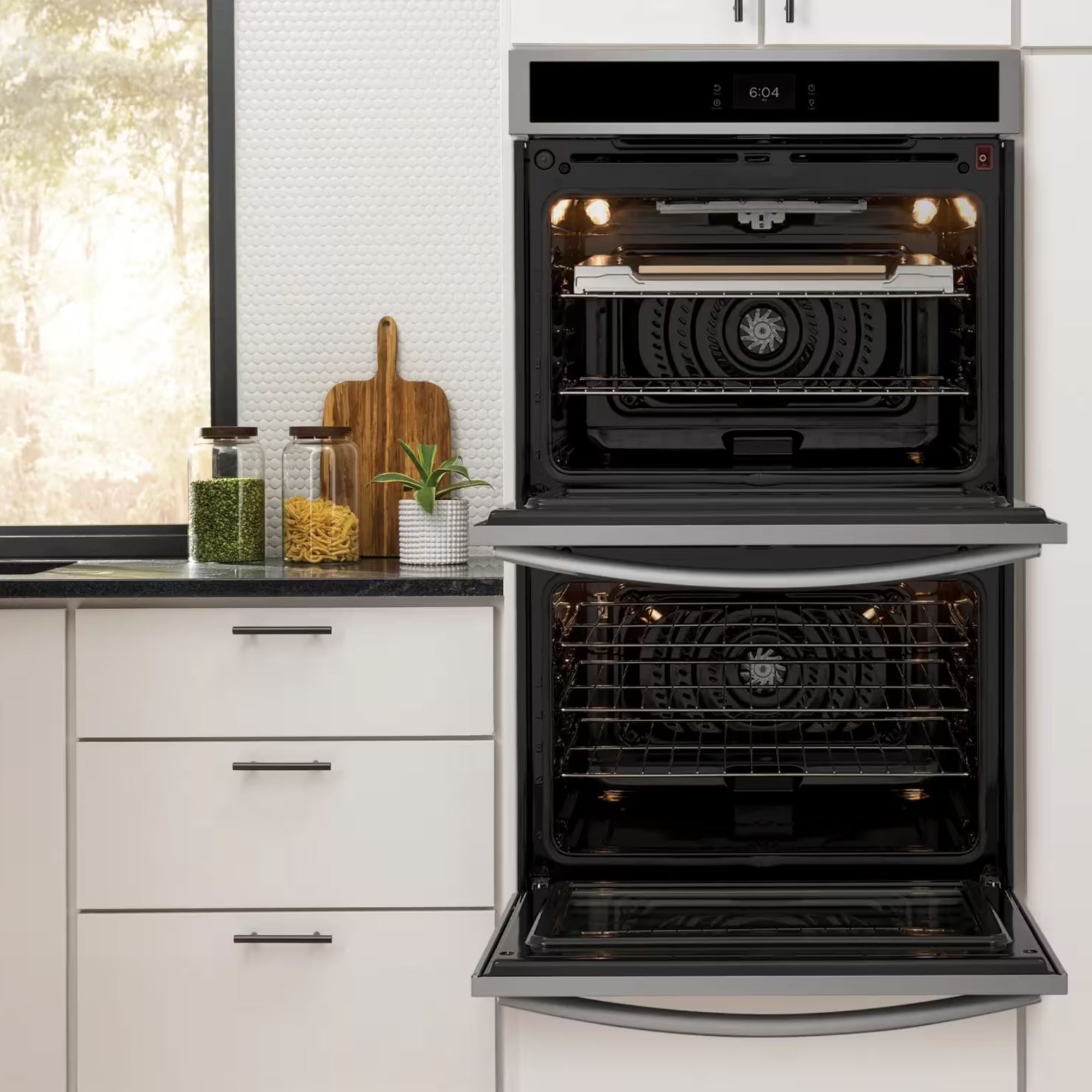 Frigidaire Gallery 30-inch double electric wall oven with stainless steel finish, featuring stone-baked pizza setting and digital controls.