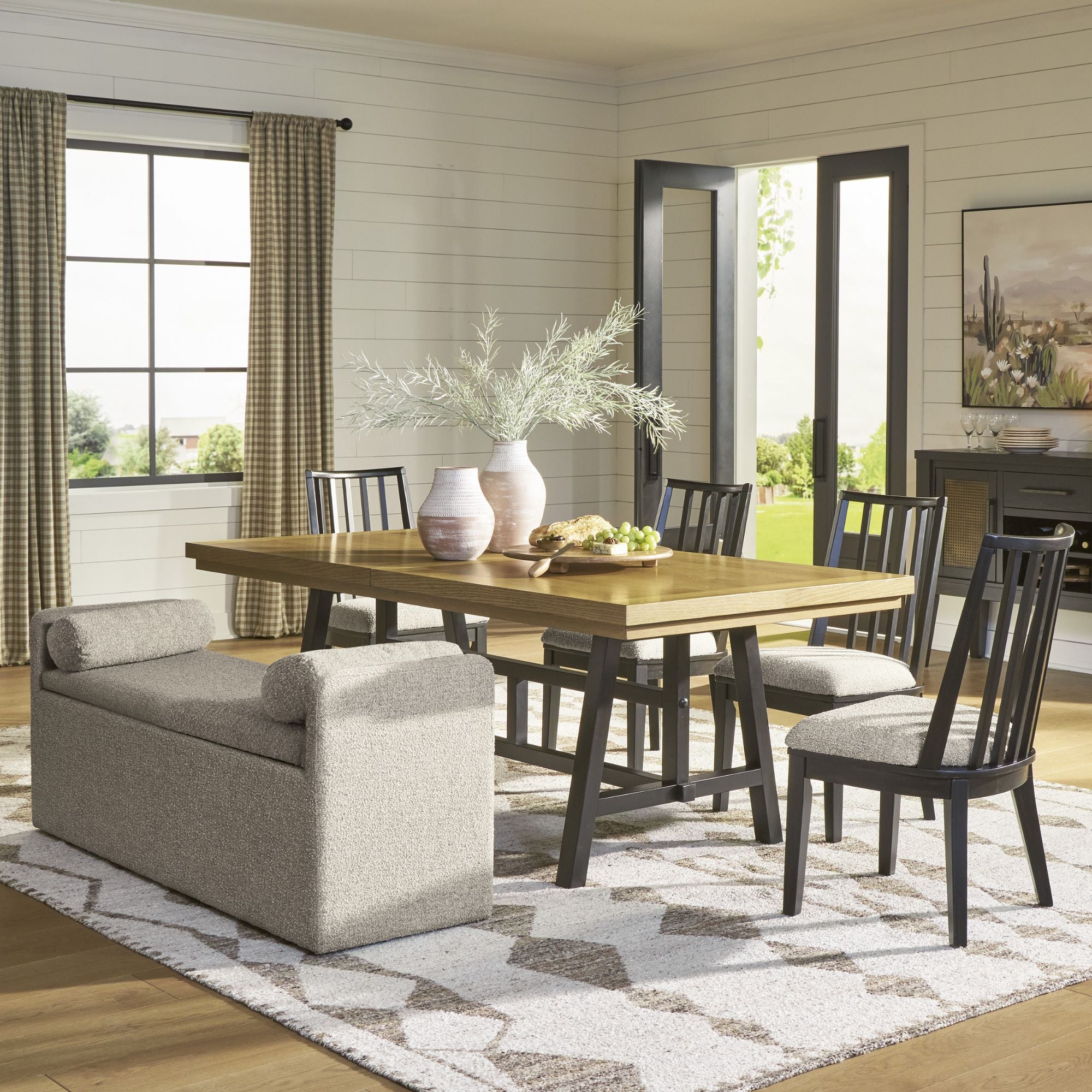 Signature Ashley Galliden dining room set with table and bench, featuring a modern design in a spacious dining area.