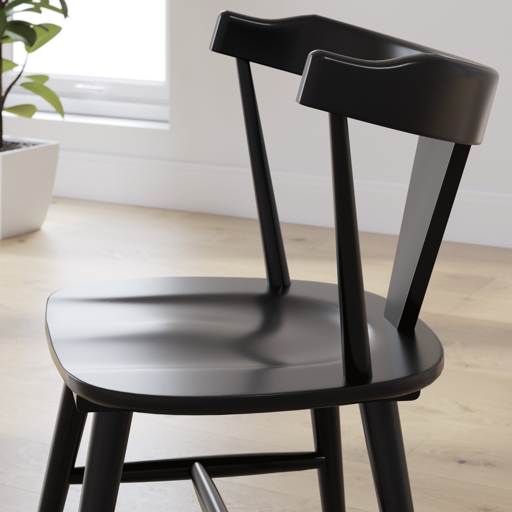 Set of two Signature Ashley Gretlynn dining room side chairs with upholstered seats and wooden legs, shown from a front angle.