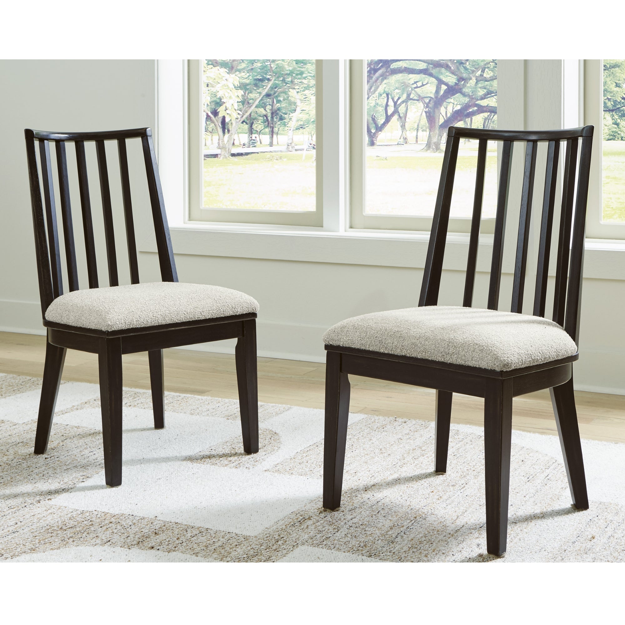 Pair of Galliden Dining UPH Side Chairs by Signature Ashley with upholstered seats and wooden legs, set of two.