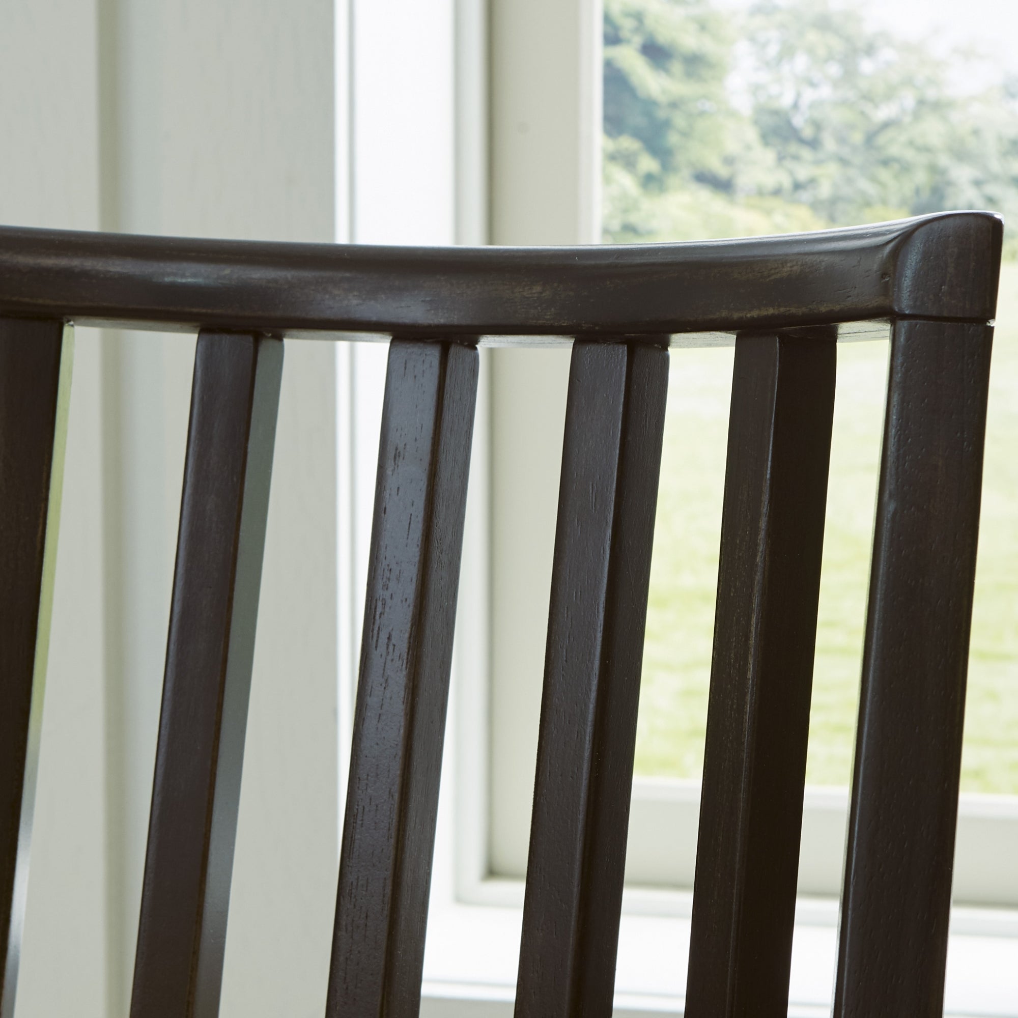 Two Galliden dining UPH side chairs by Signature Ashley with upholstered seats and wooden legs, arranged in a modern dining room setting.
