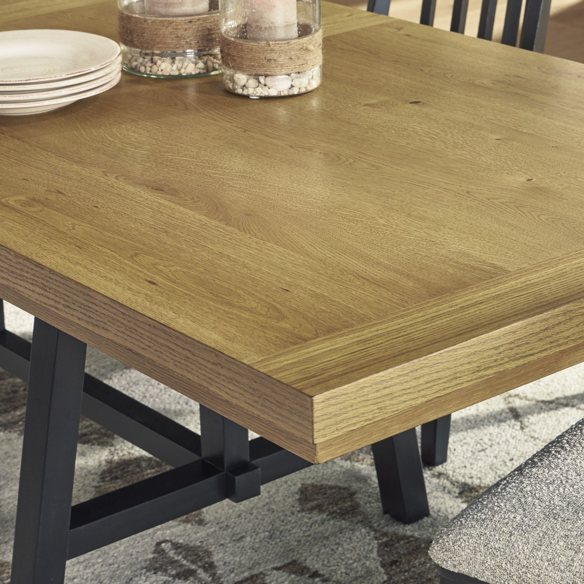 Signature Ashley Galliden EXT Dining Table with wood finish, showcasing its extendable design and sturdy rectangular tabletop.