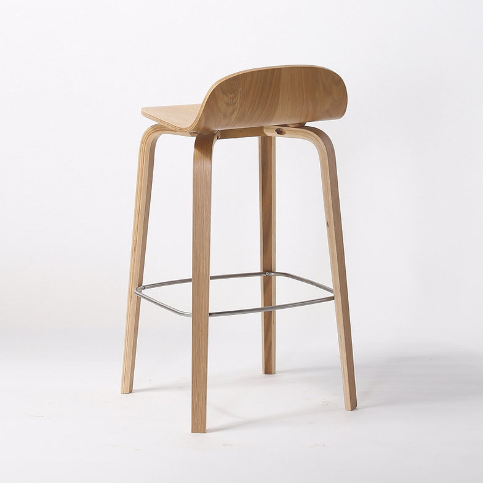 Natural wood Glen Modern bar stool from Elite Living featuring a sleek, minimalist design with a round wooden seat and sturdy legs.