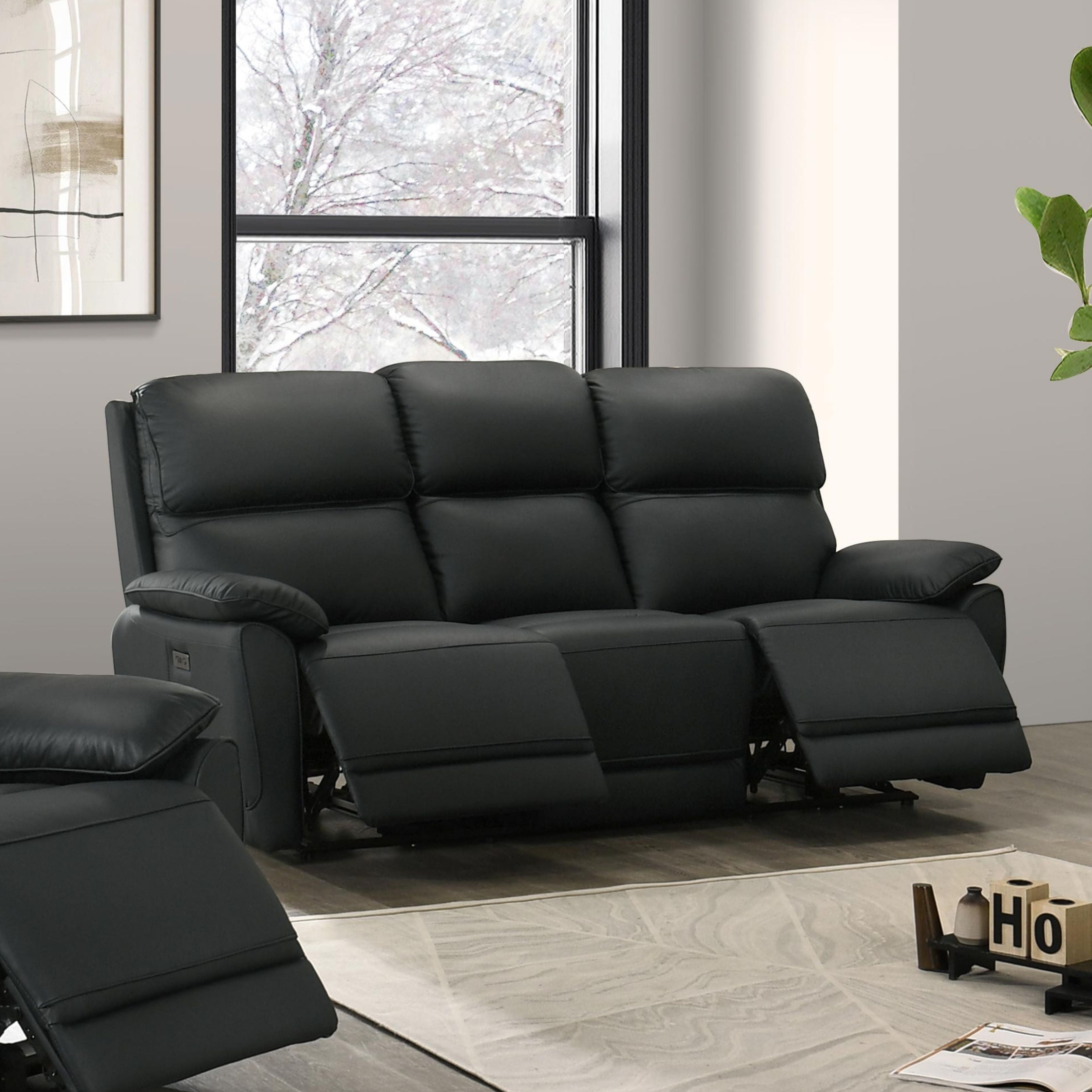 Black Grand Luxe Leather Power Recliner Sofa by IFF featuring plush cushions and sleek design, perfect for modern living rooms.