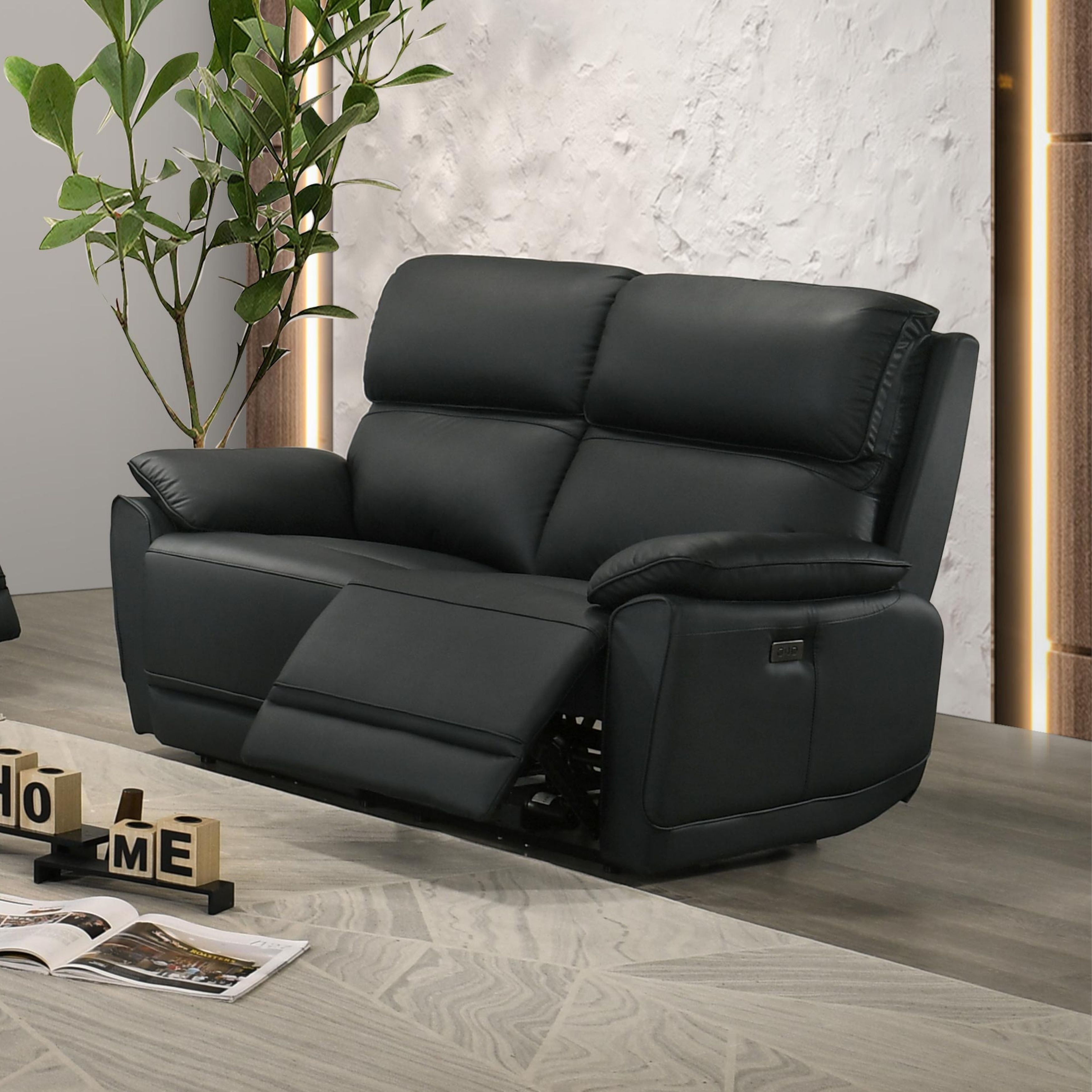 Black Grand Luxe leather power recliner loveseat by IFF, featuring plush cushioning and modern design in a stylish living room setting.