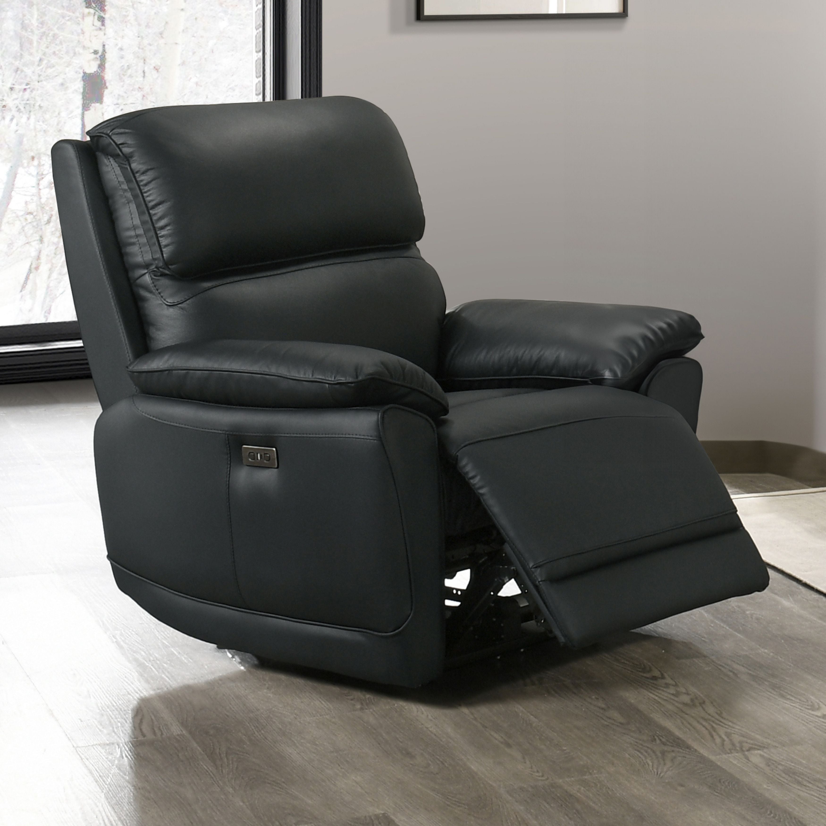 Black Grand Luxe Leather Power Recliner from IFF, showing a plush, modern reclining chair with padded armrests and smooth leather finish.