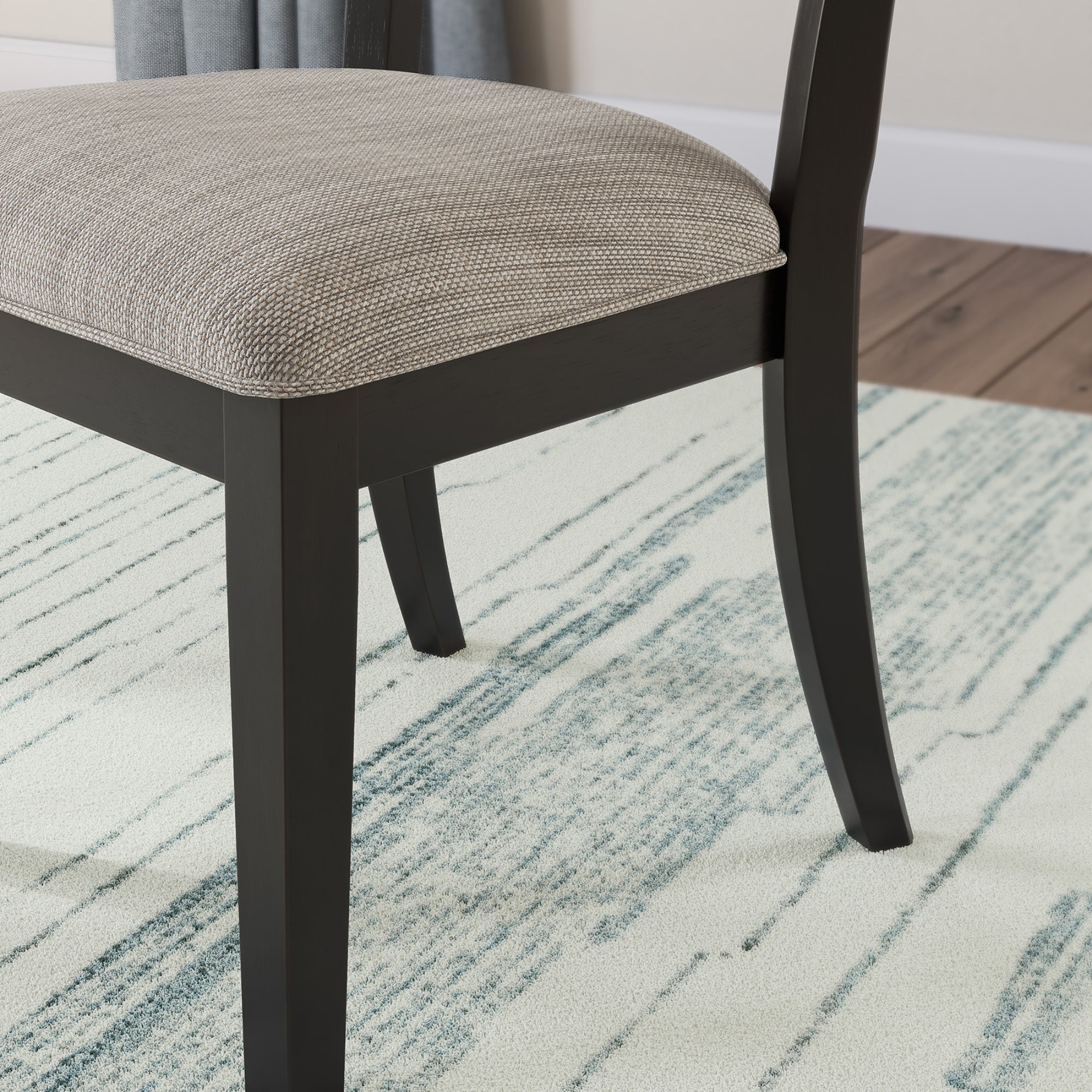Set of two black Greddinton Dining UPH Side Chairs by Signature Ashley, showcasing sleek upholstered design and sturdy wooden legs.