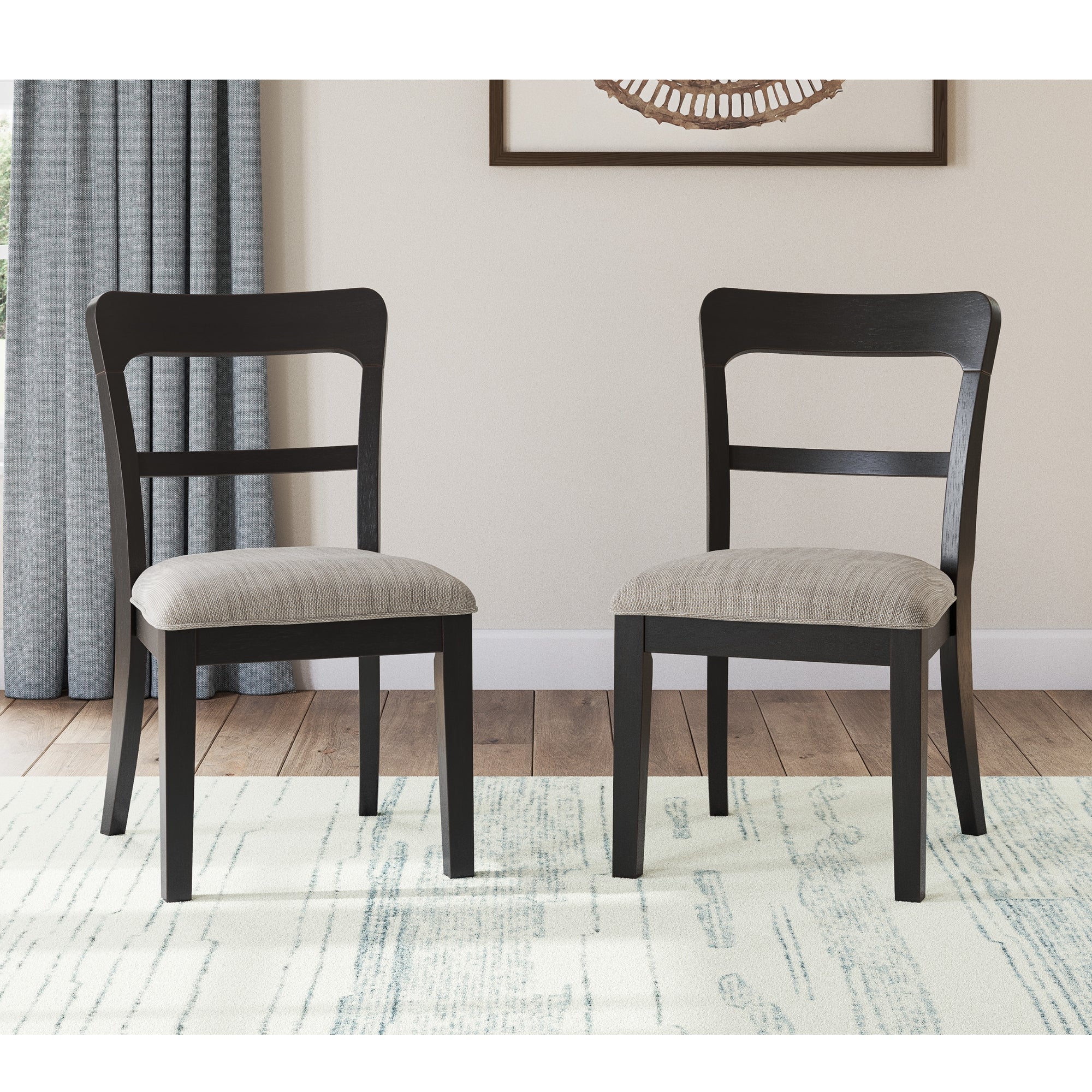 Two black Greddinton dining side chairs from Signature Ashley with upholstered seats and sleek wooden legs, set against a neutral background.