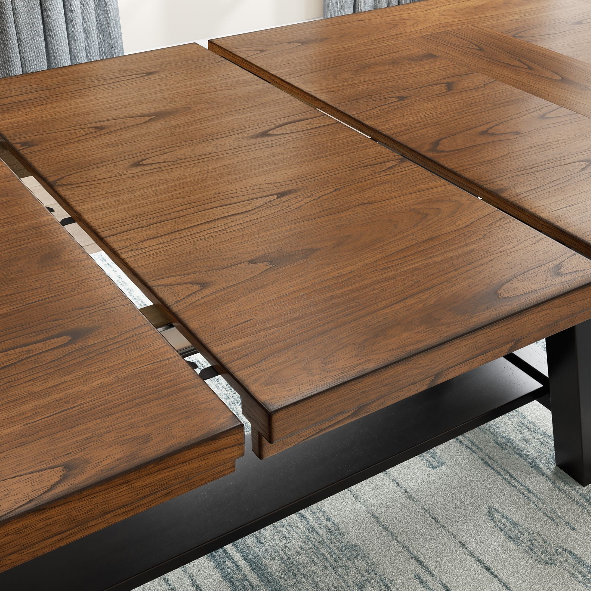 Signature Ashley Greddinton extension dining table with polished wood surface and sturdy legs in a modern kitchen setting.