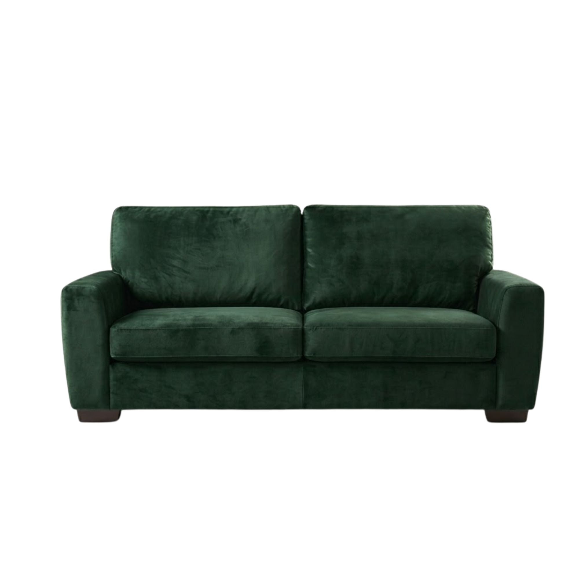 ComfortStyle Canadian made Coulter sofa in lush green velvet with plush cushions and sleek wooden legs.