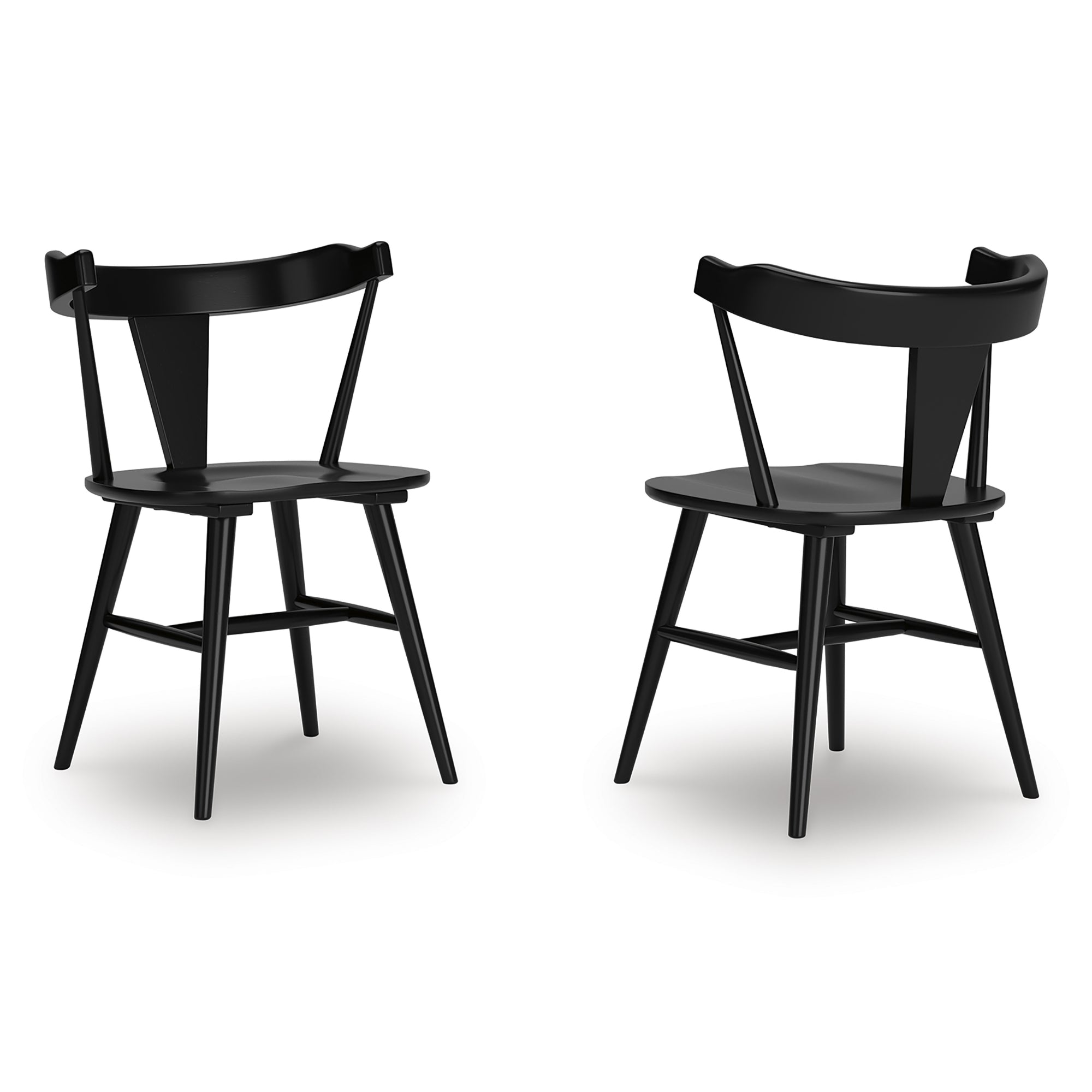 Pair of Gretlynn dining room side chairs by Signature Ashley, featuring upholstered seats and wooden legs for elegant dining decor.