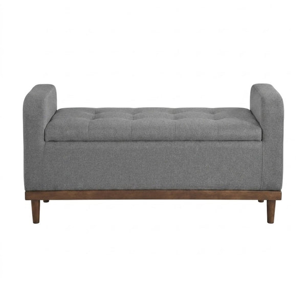 Gray MAZ Brigitte Collection lift-top storage ottoman with a cushioned top and spacious interior for versatile seating and storage.
