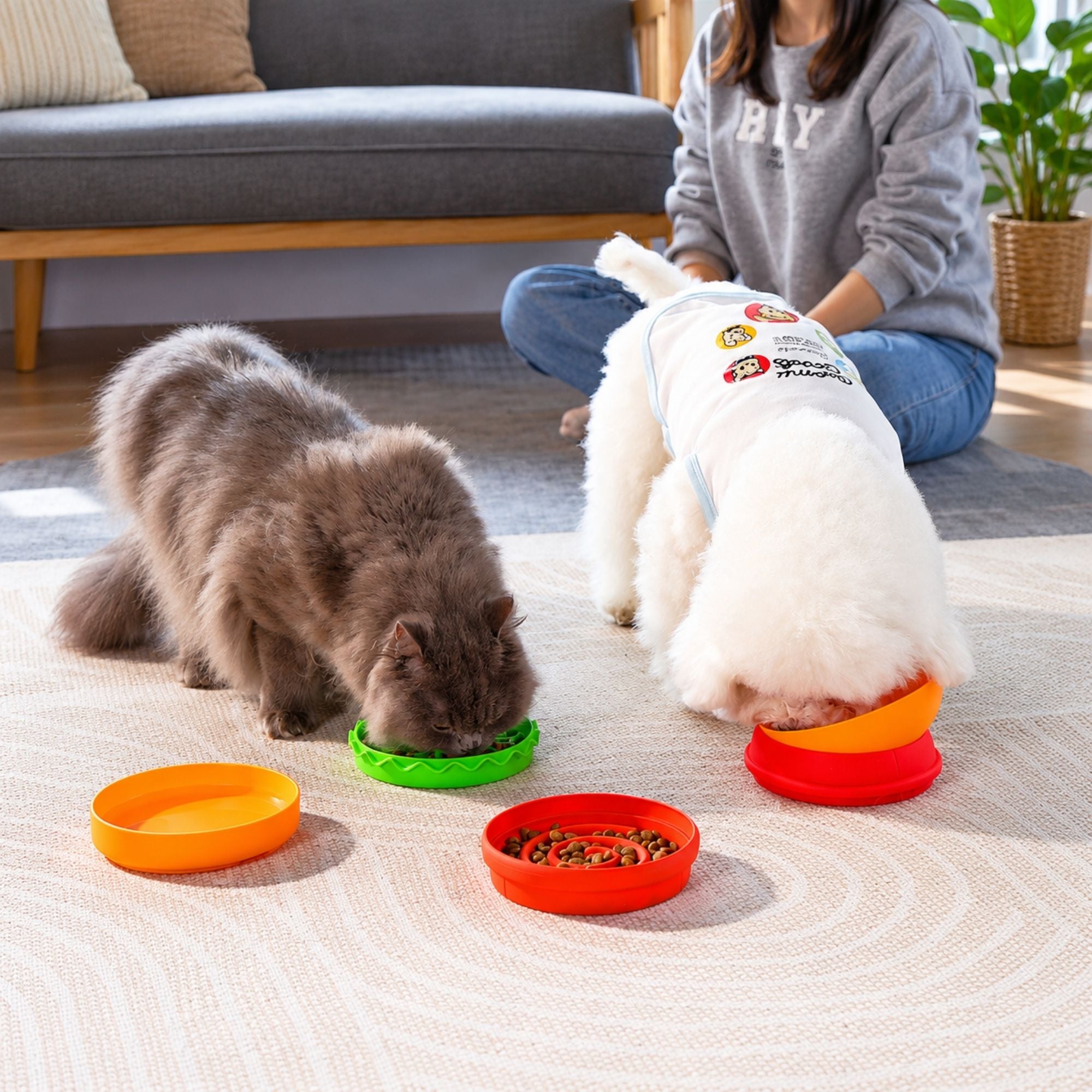 Orange Superdesign hamburger-shaped slow feeder pet bowl for dogs by CastleUp Experience Centre