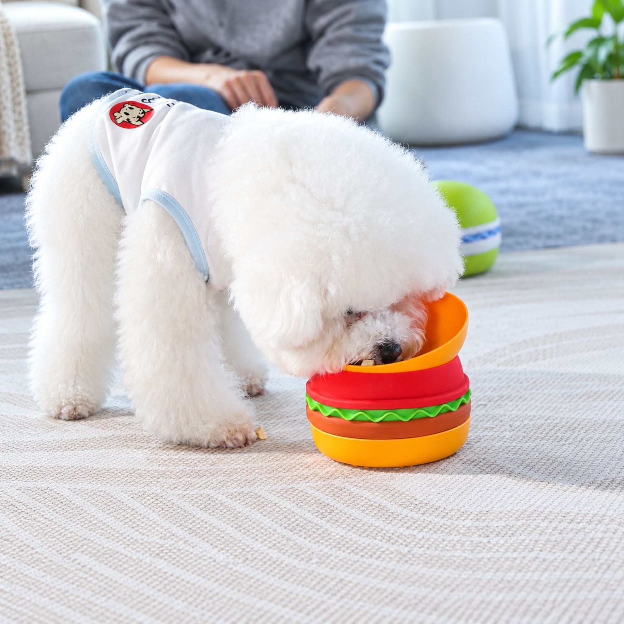 Orange Superdesign hamburger-shaped slow feeder pet bowl with textured sections for pets' meals
