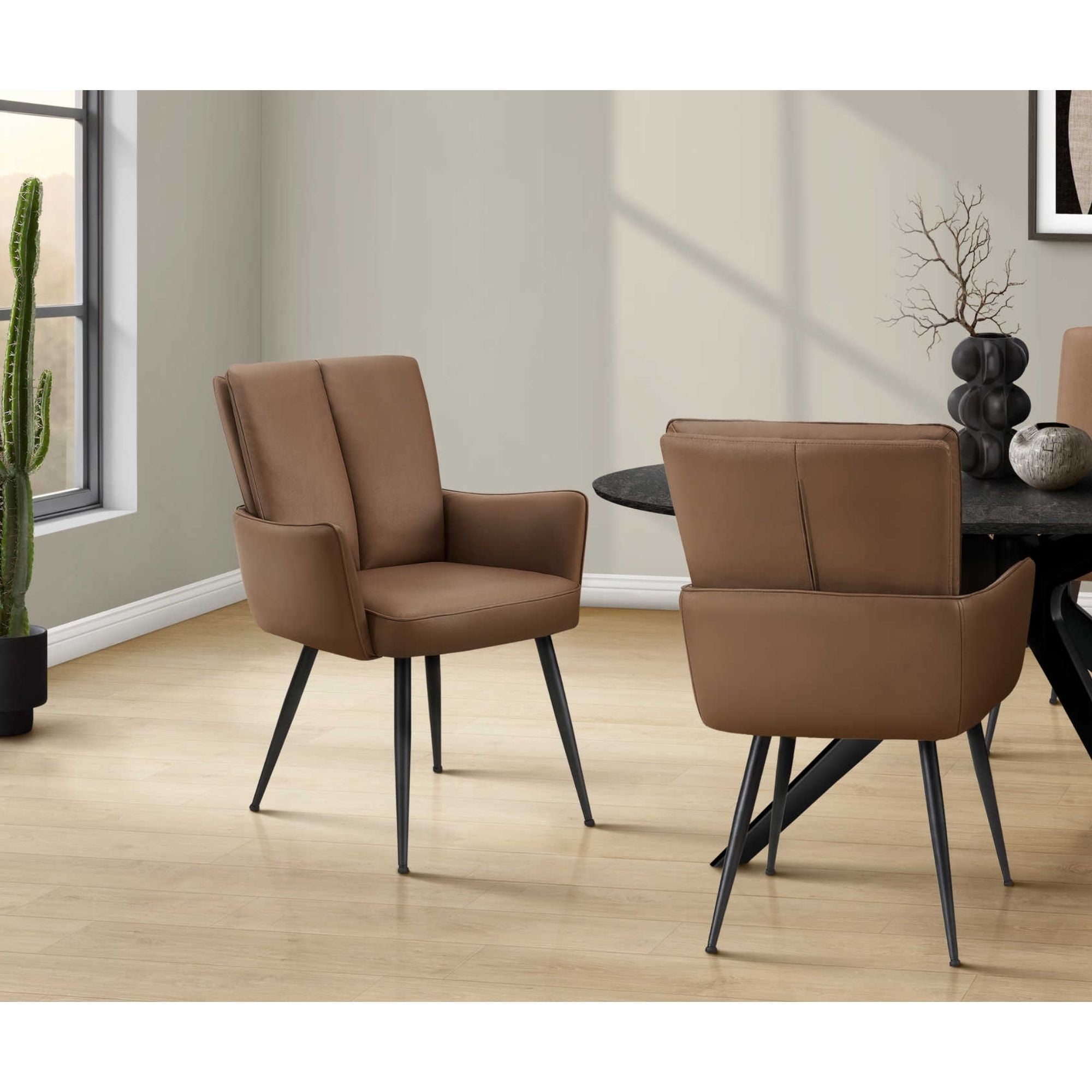 Set of two light brown leather-look dining chairs with black metal legs by Monarch Specialties for modern kitchen or dining room decor.