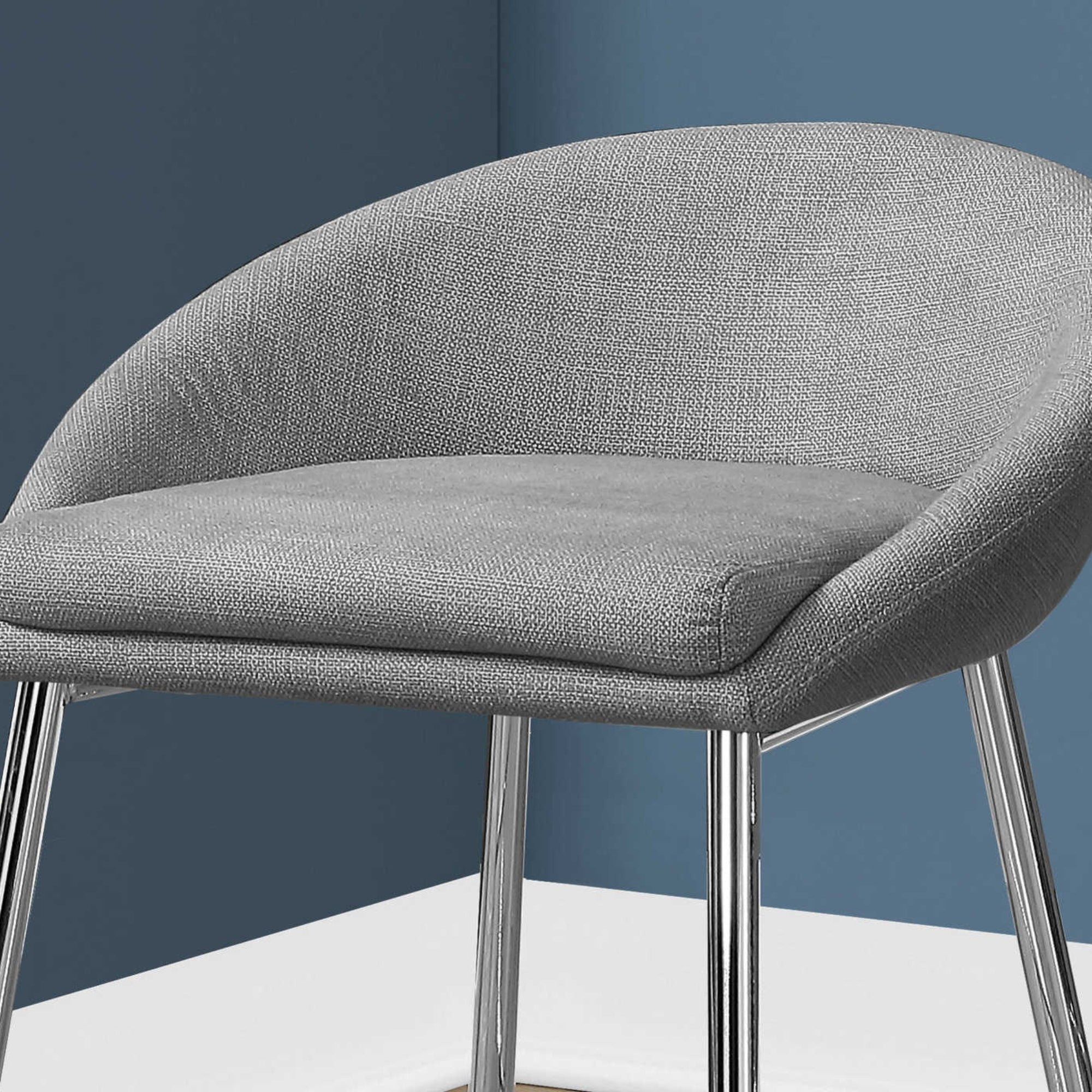Pair of Luna Grey Monarch Specialties counter height bar stools with metal legs and cushioned seats, set of 2.