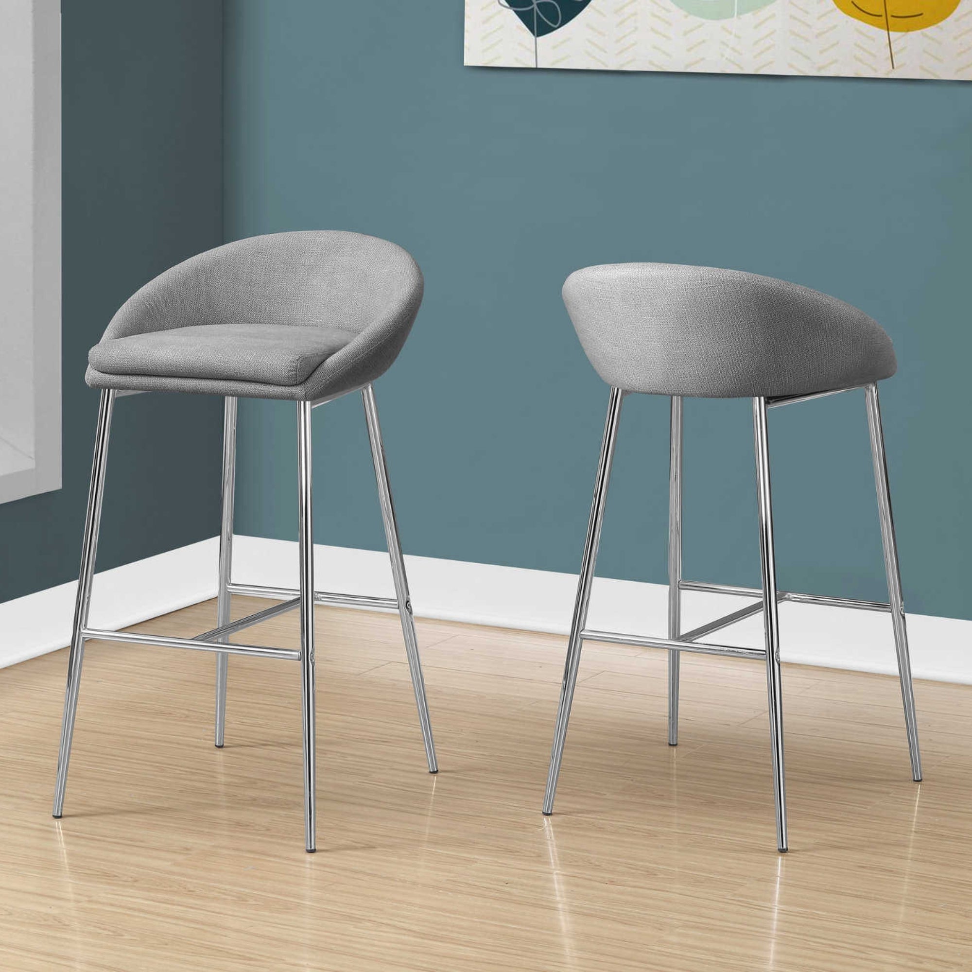 Set of two Luna Grey Monarch Specialties bar stools with cushioned seats and metal legs, ideal for kitchen or bar area.