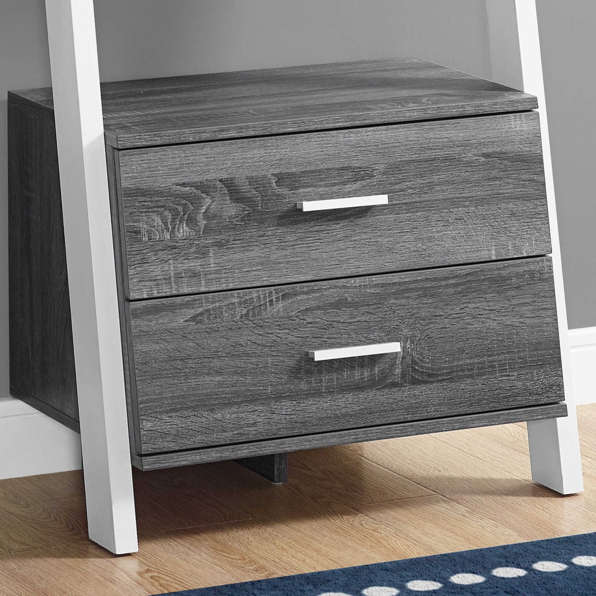 Grey 69-inch ladder-style bookcase with two storage drawers from Monarch Specialties, showcasing open shelves and drawer compartments.