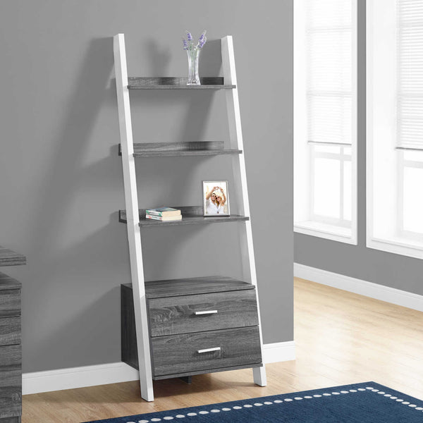 Grey ladder bookcase from Monarch Specialties with 2 storage drawers and open shelves for books and decor.