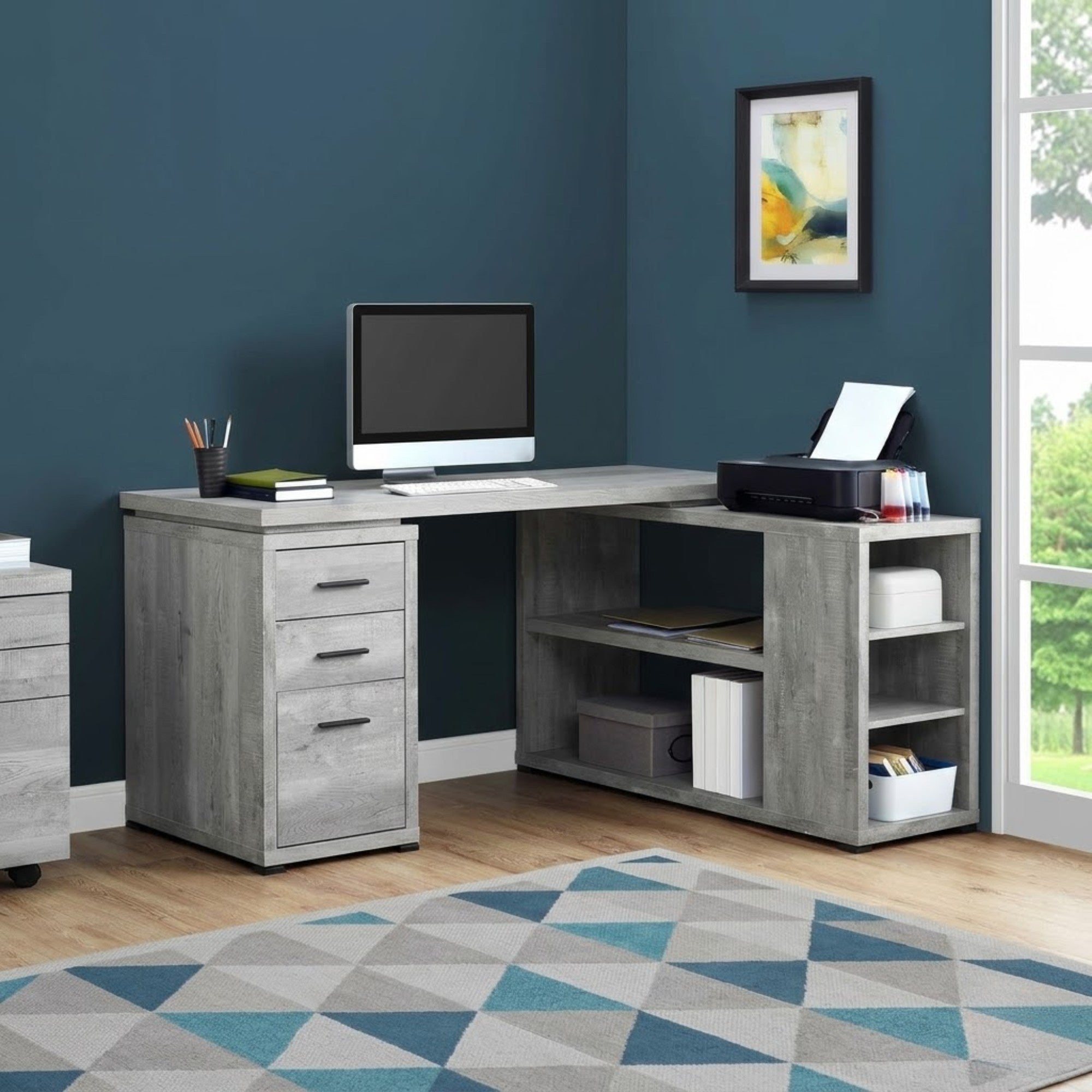 Grey Elevare L-shaped corner office desk with storage and file drawer by Monarch Specialties, shown in a modern workspace setting.