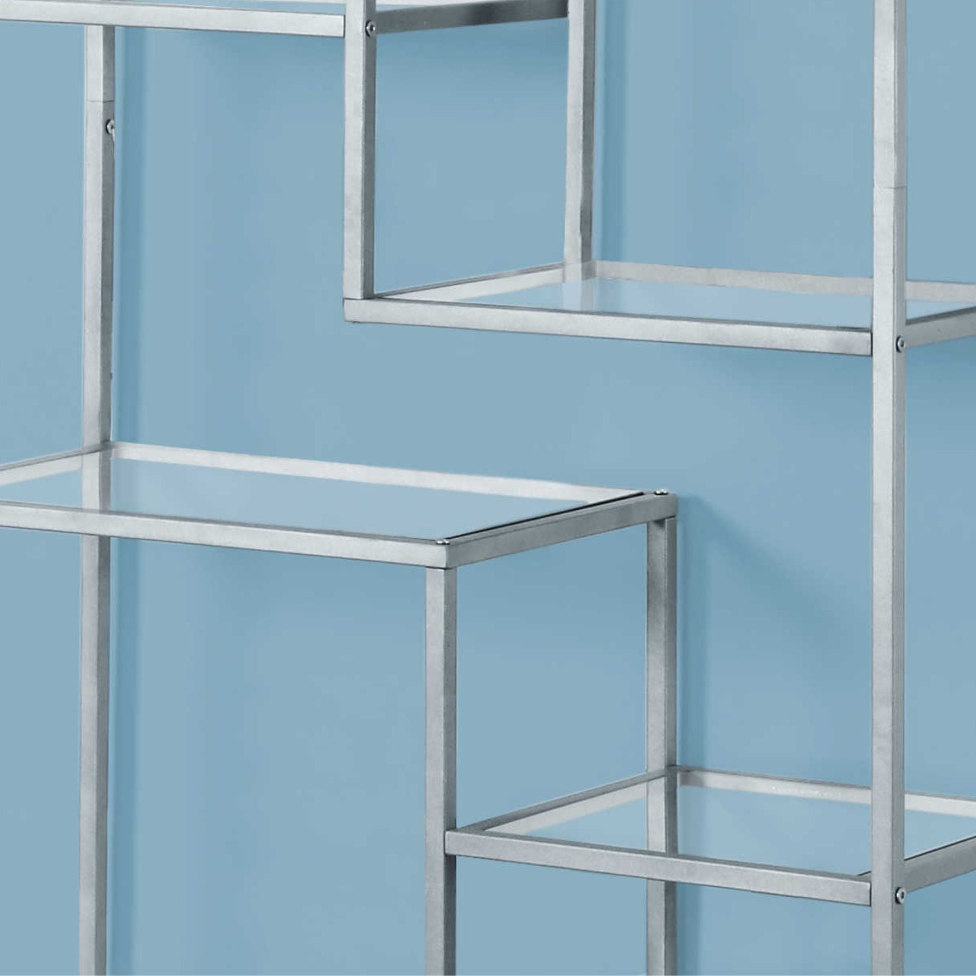 Silver metal and tempered glass bookcase by Monarch Specialties, 72 inches tall with multiple shelves for storage and display.