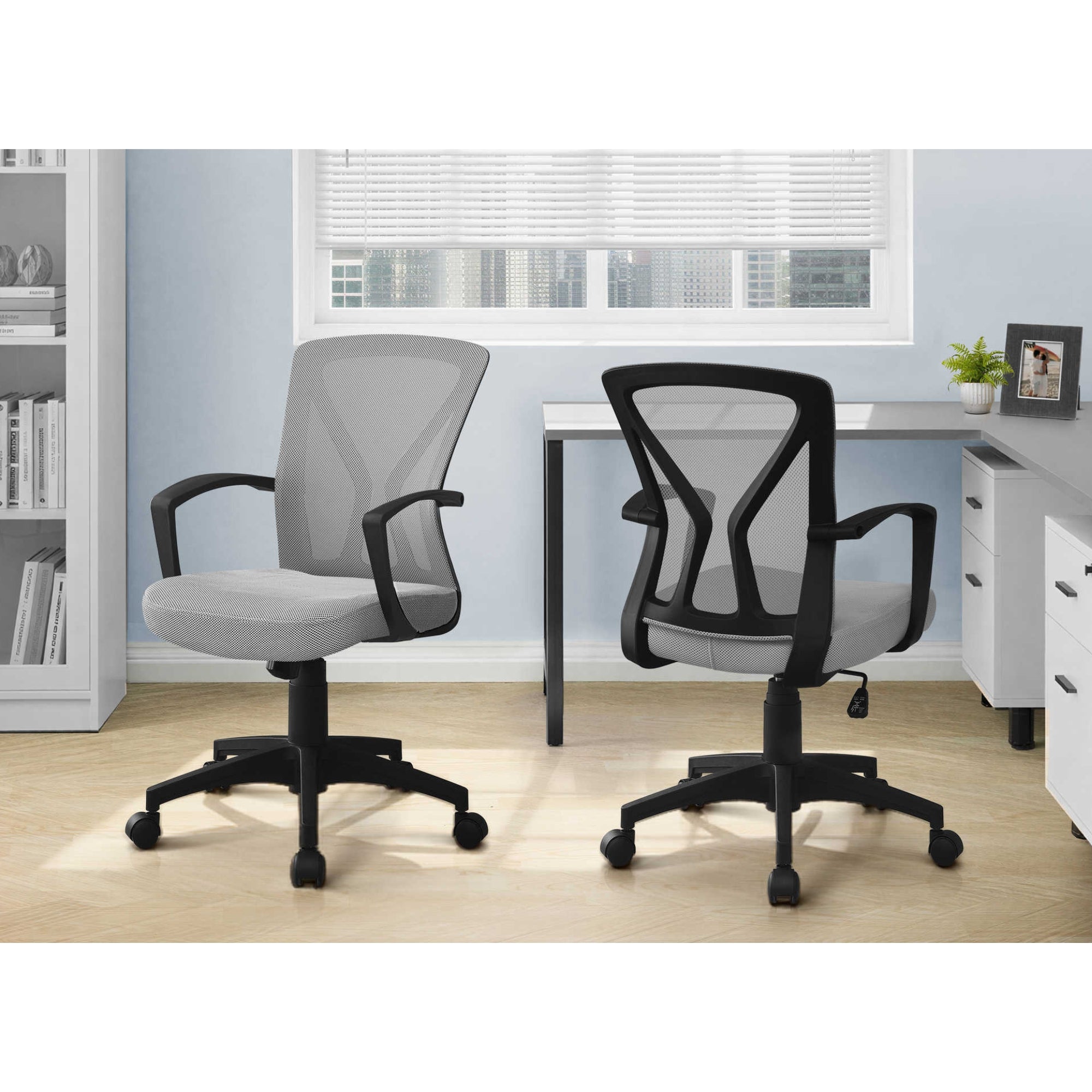Modern grey mid-back office chair from CastleUp Experience Centre, featuring ergonomic design and adjustable height.