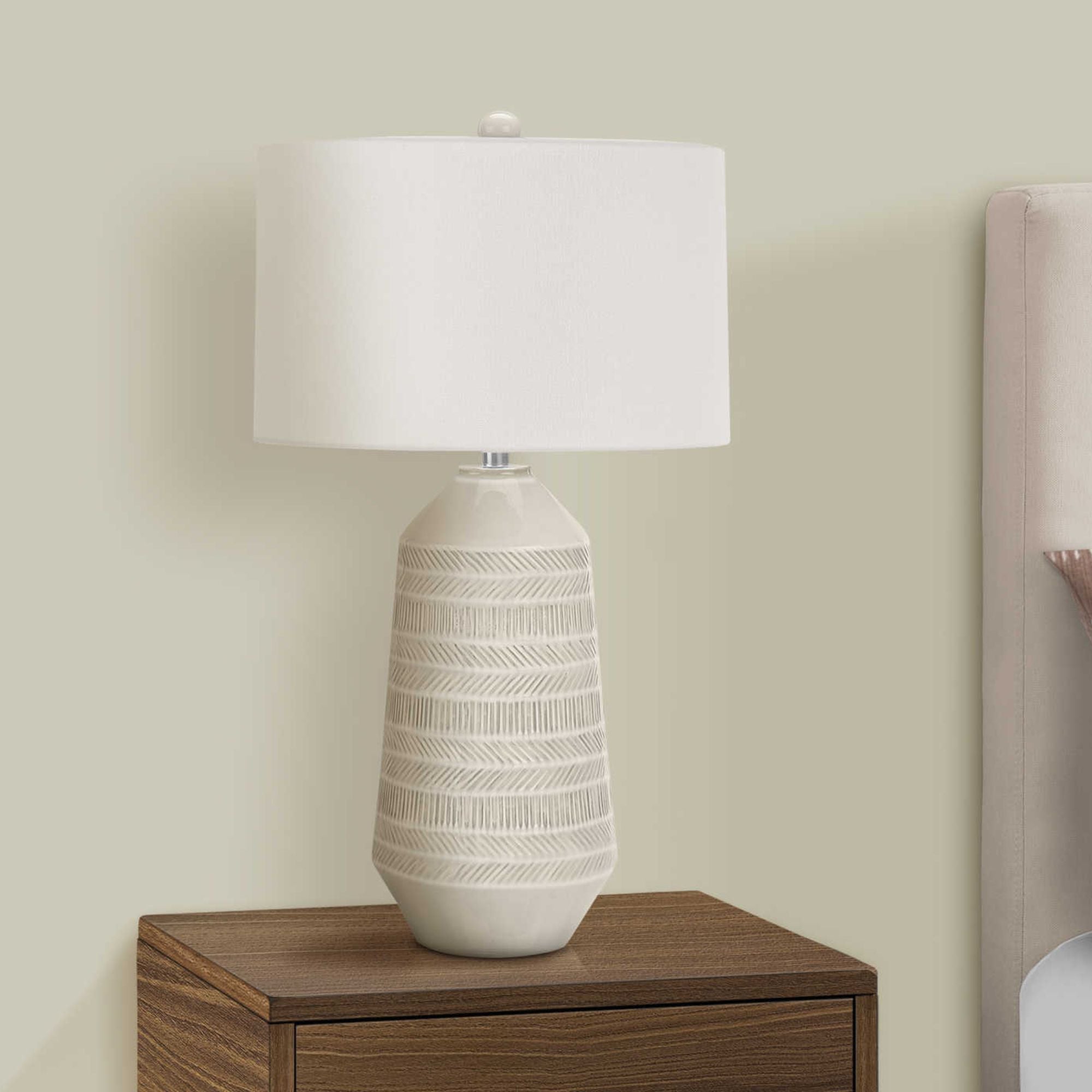 Cream ceramic table lamp from Monarch Specialties, 33 inches tall, with a sleek design and a decorative base.