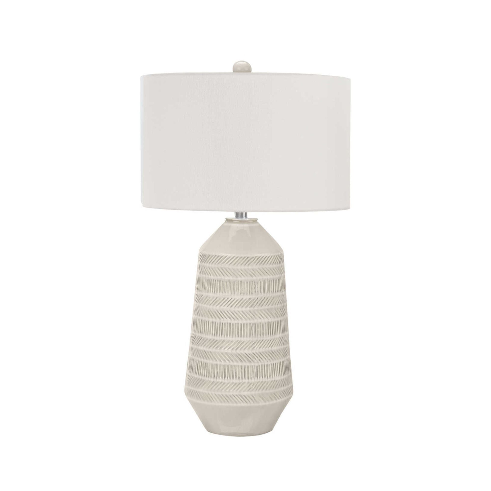 Cream ceramic table lamp standing 33 inches tall by Monarch Specialties with a sleek, modern design and round base.
