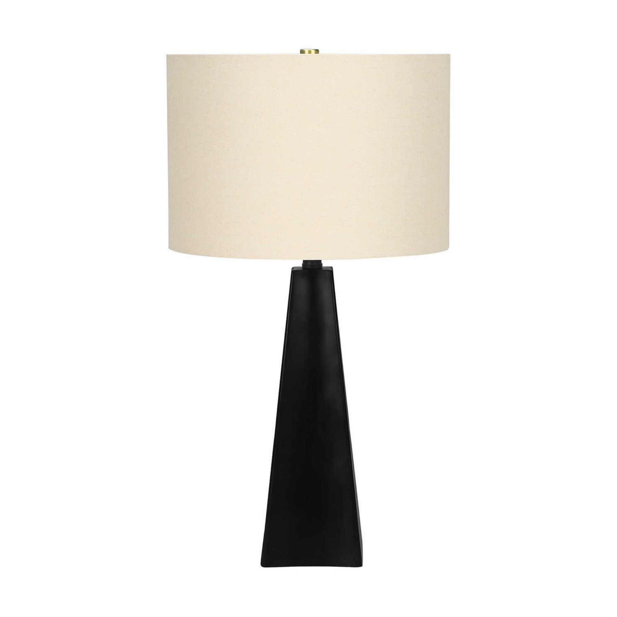 Modern black resin table lamp with beige fabric shade, 27 inches tall, by Monarch Specialties.