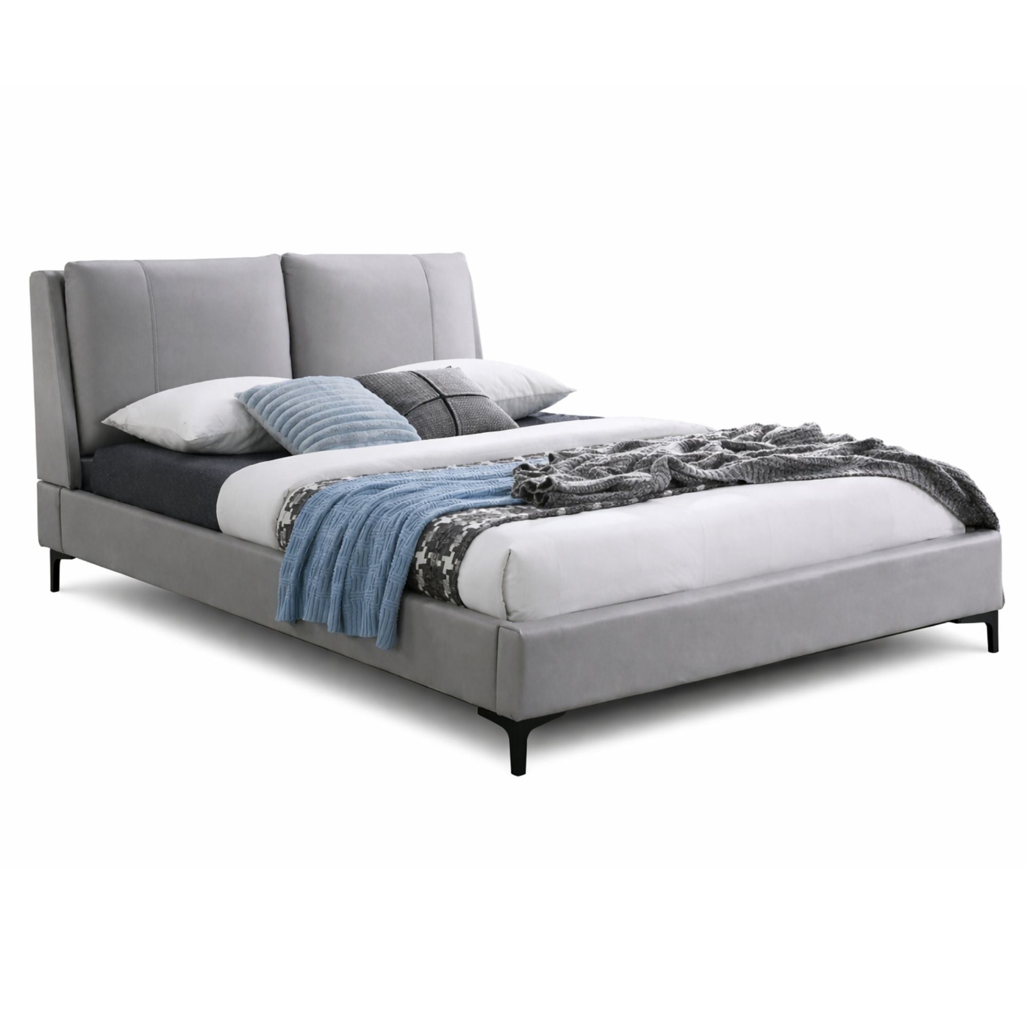 Aria upholstered platform bed by IFF with a padded headboard and sleek frame, shown in a modern bedroom setting.