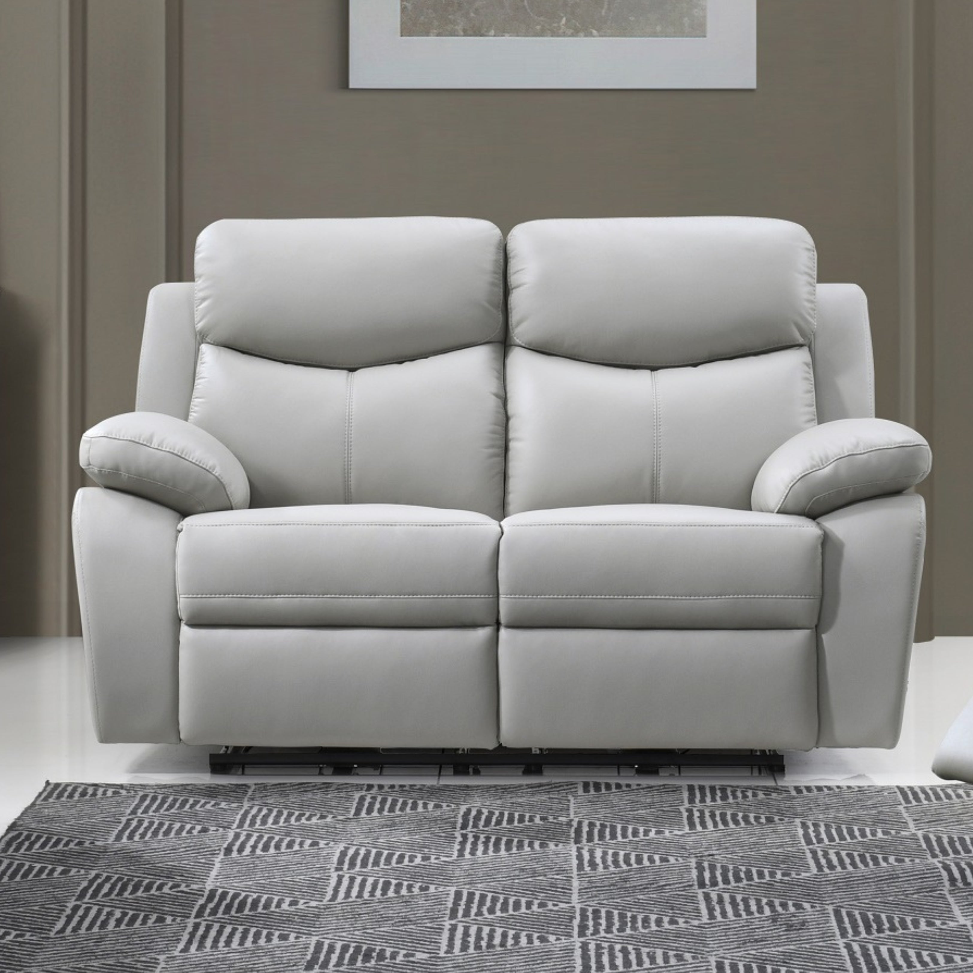 Light grey Axton Luxe leather power recliner loveseat by IFF, featuring plush cushions and modern reclining design.