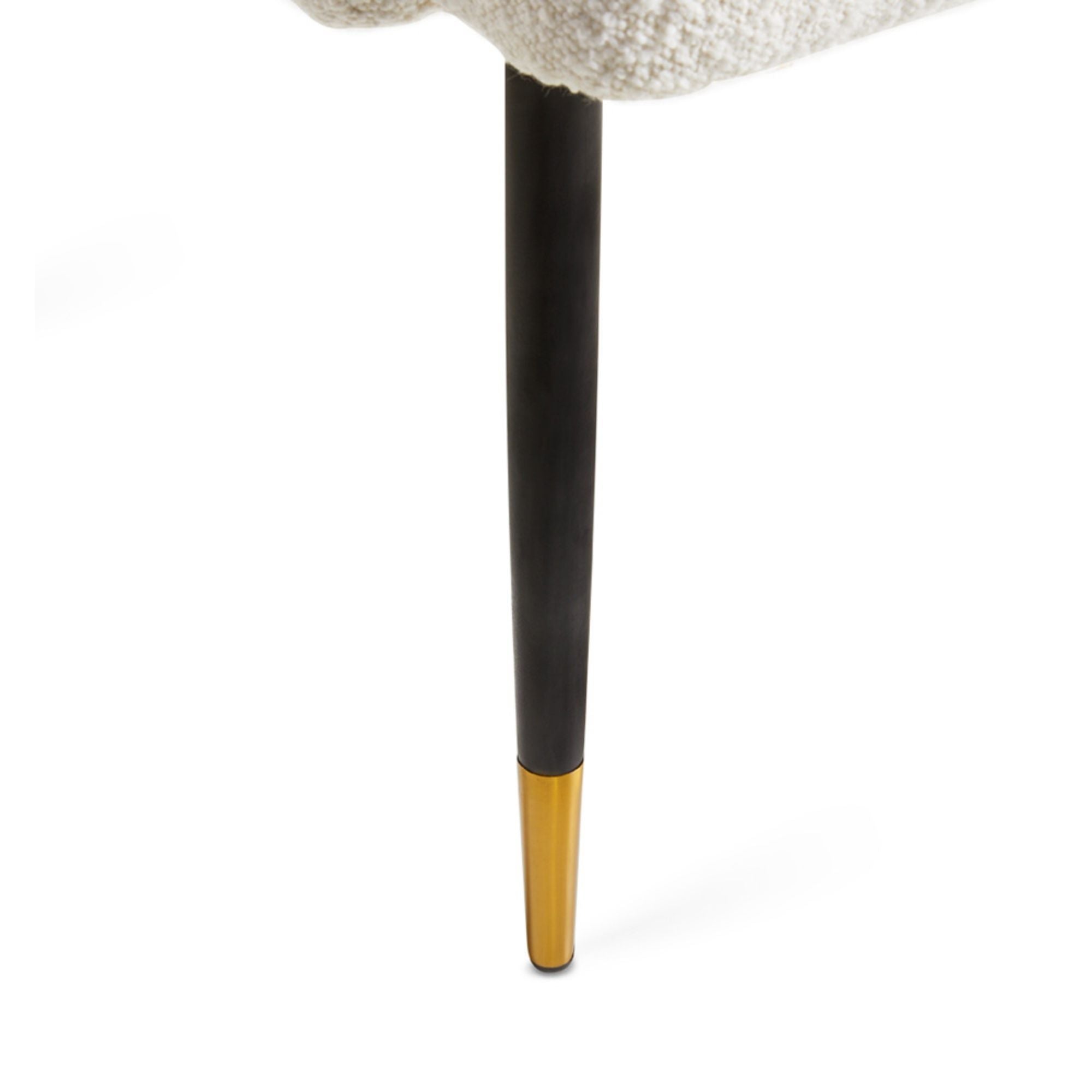 White Jordan dining chair by Xcella with boucle upholstery, showcasing modern design and sleek wooden legs.