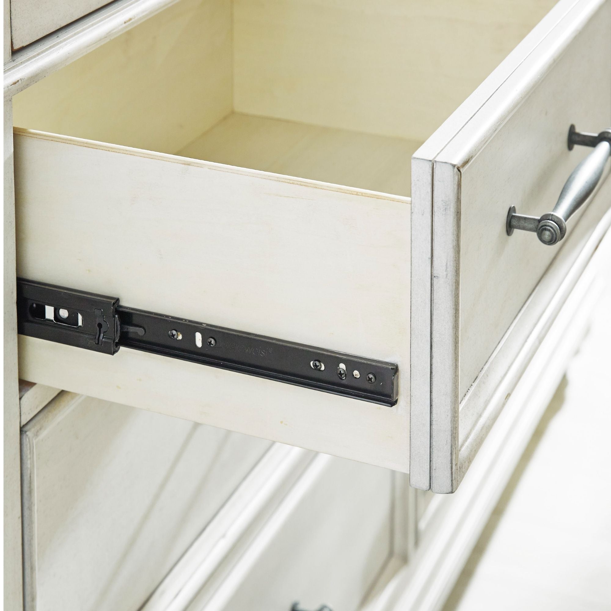 White Kanwyn dresser from Signature Ashley, showcasing a modern bedroom storage piece with sleek drawers and contemporary design.