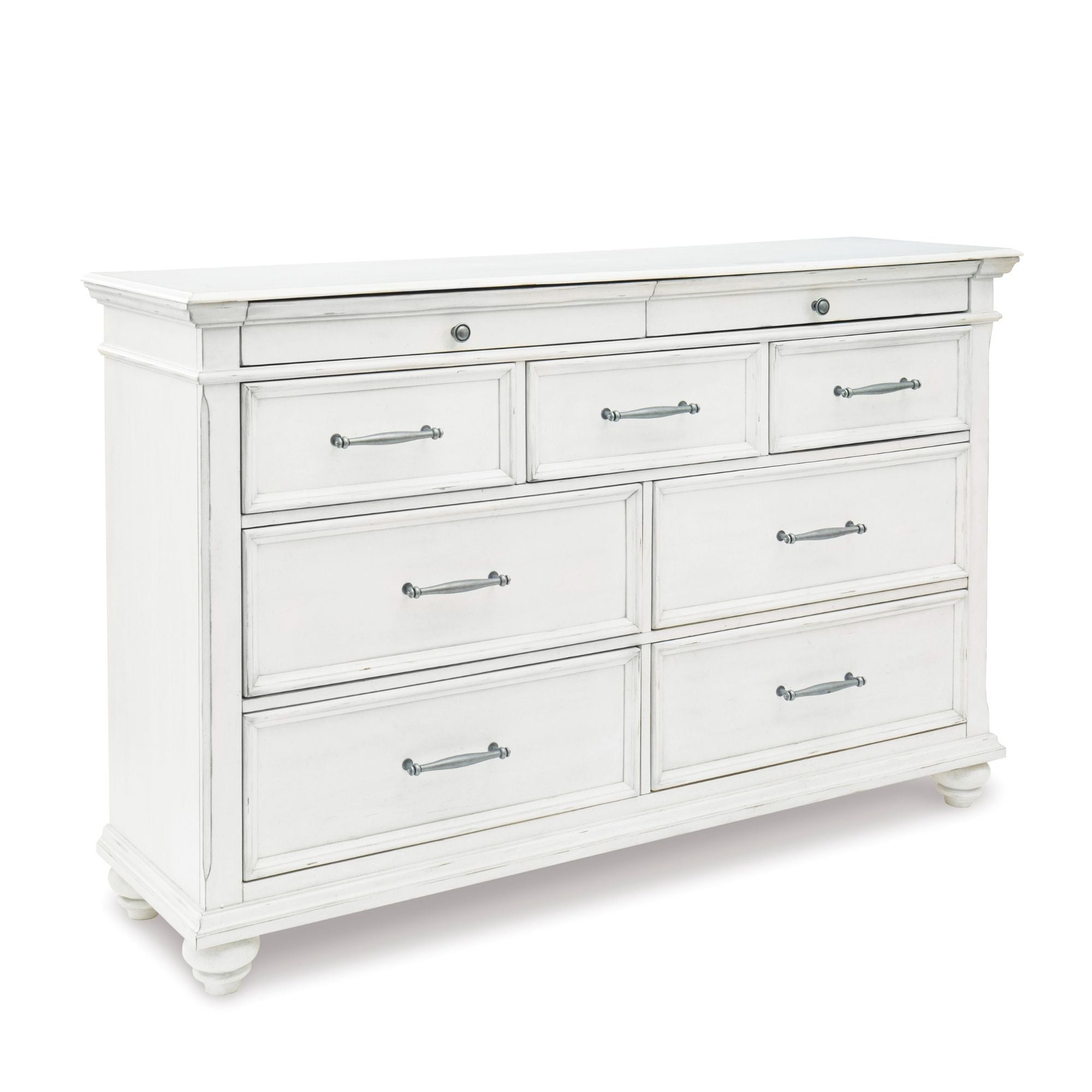 White Kanwyn dresser from Signature Ashley with multiple drawers, part of the bedroom set, showcasing a modern storage solution.