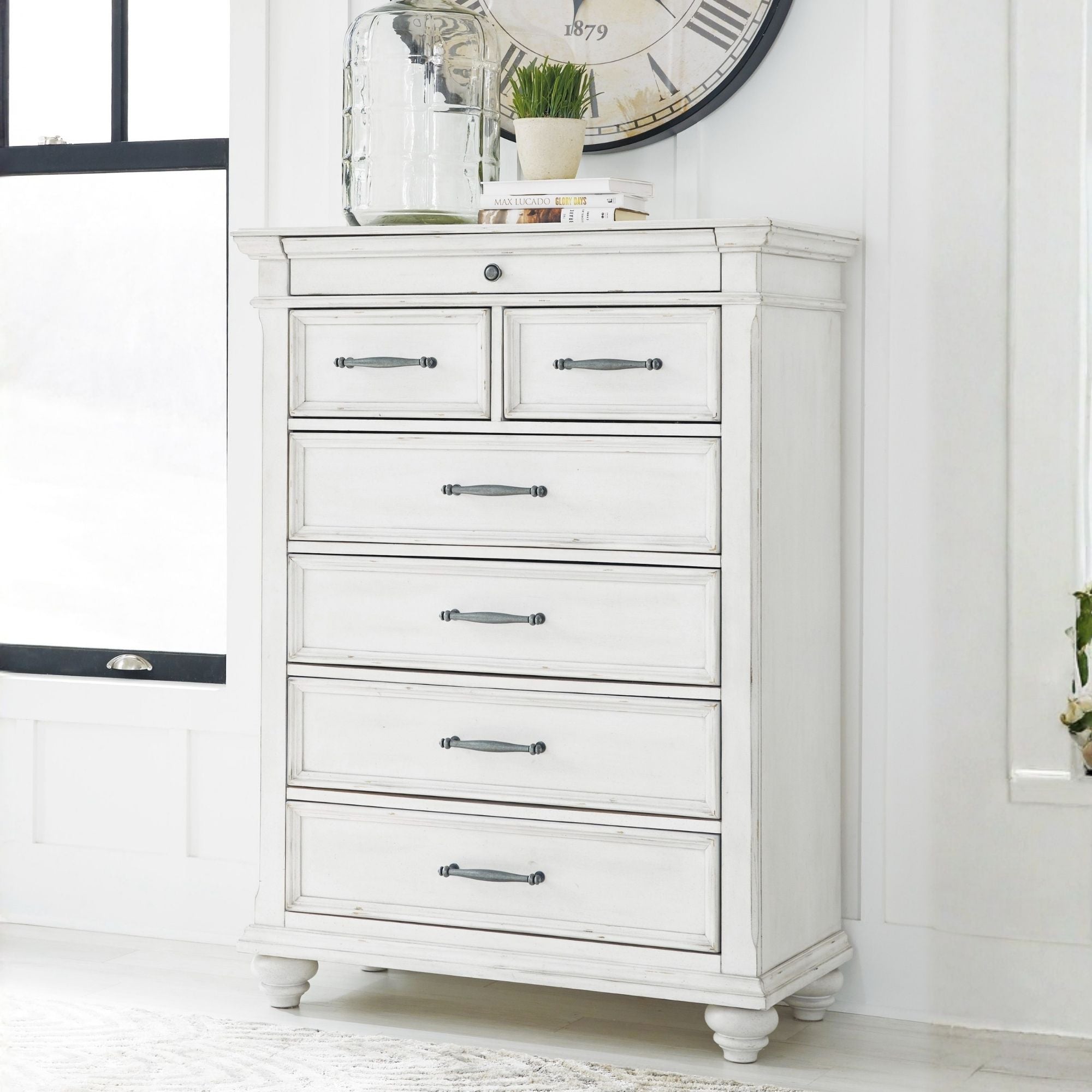 White Kanwyn chest from Signature Ashley, showcasing a stylish bedroom storage piece with clean lines and elegant design.