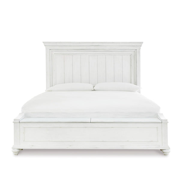 White Kanwyn panel bed with built-in storage bench from Signature Ashley, showcasing a sleek bedroom setup with clean lines.
