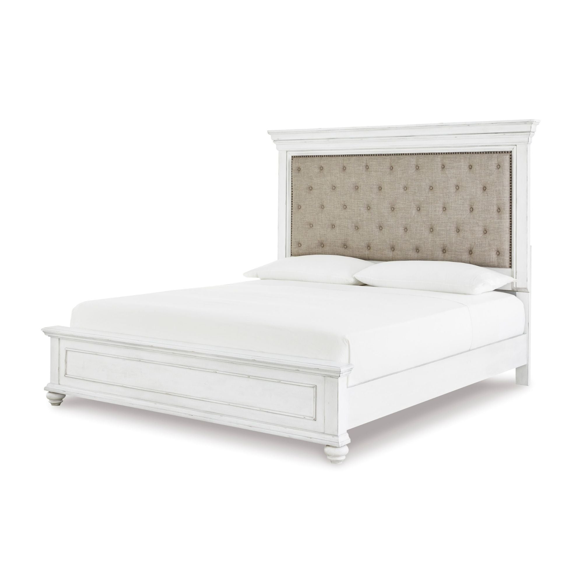 White upholstered panel bed from the Kanwyn collection by Signature Ashley, showcasing a modern and comfortable bedroom centerpiece.