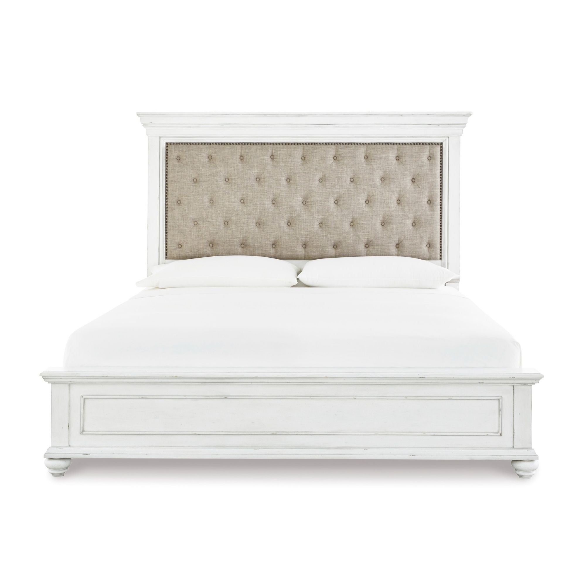 White Kanwyn Upholstered Panel Bed by Signature Ashley, showcasing the elegant headboard and modern design in a bedroom setting.