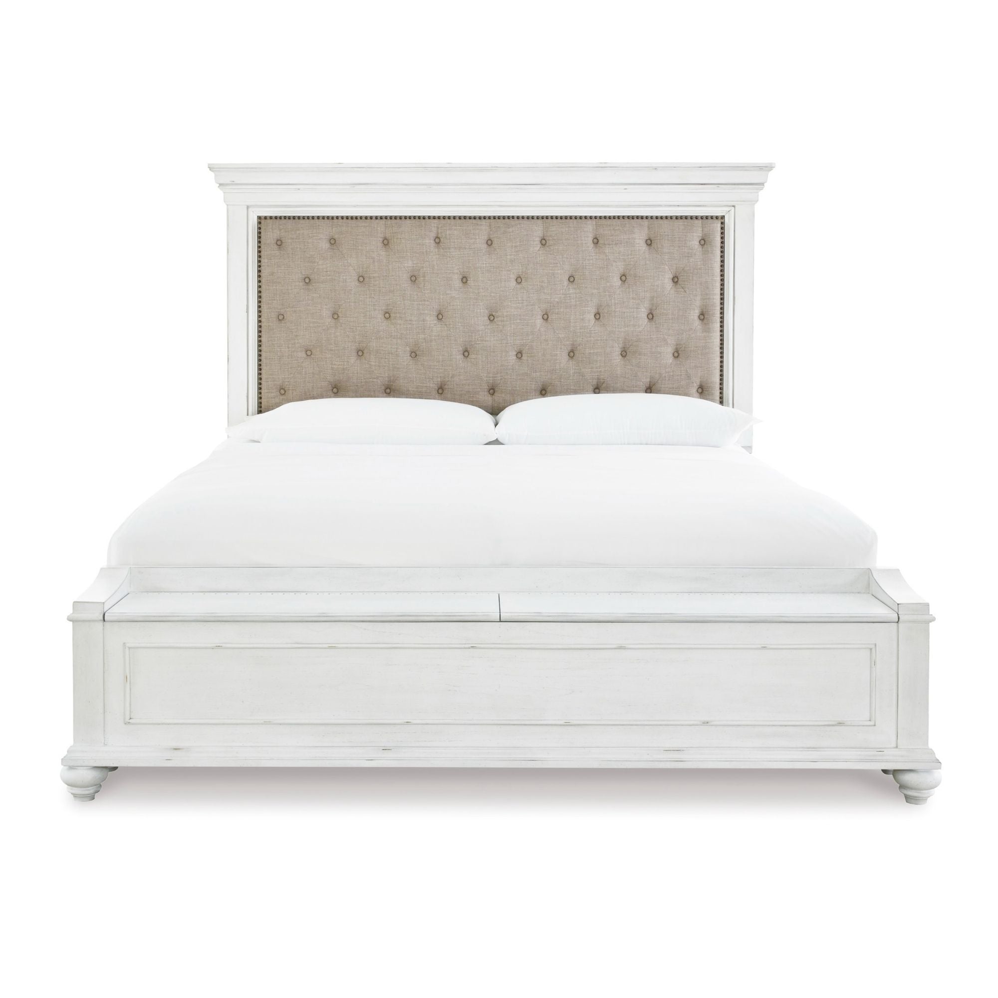 White upholstered Kanwyn panel bed by Signature Ashley with built-in storage bench and matching bedroom set.