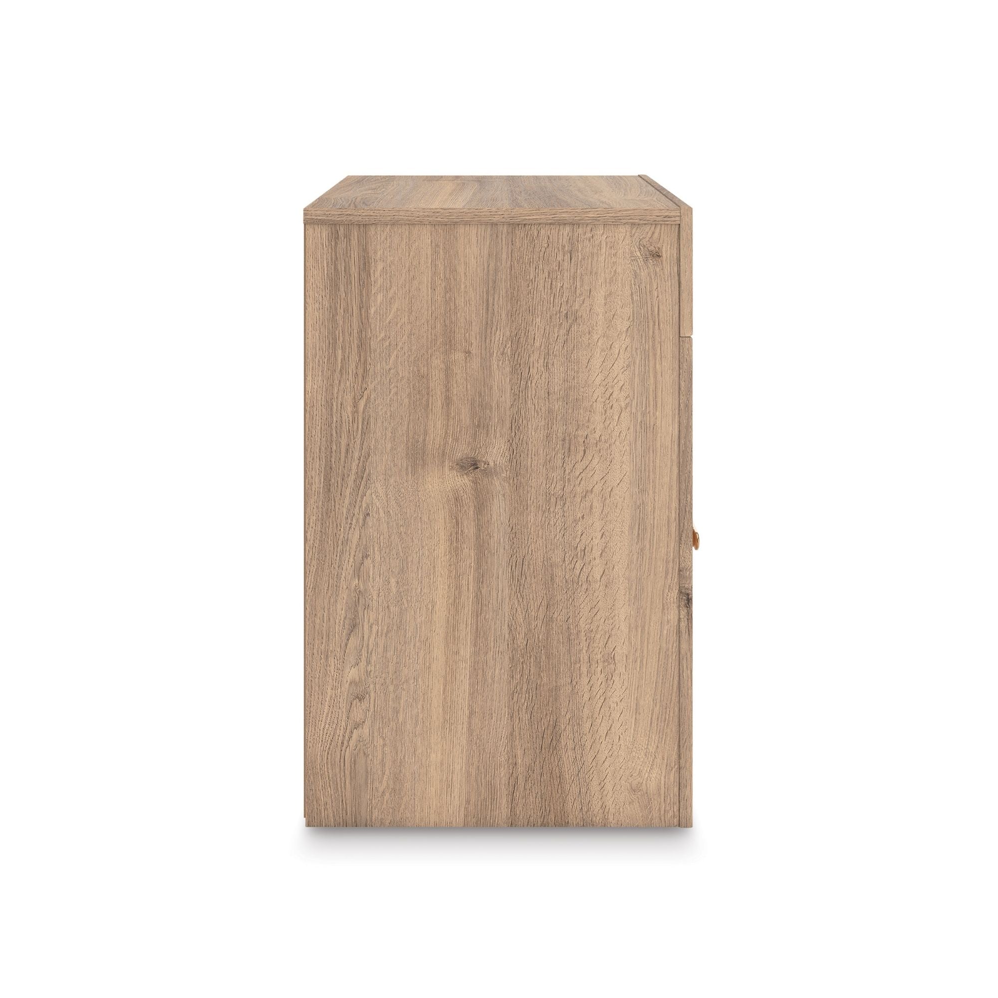 Tan Kinlanni one drawer nightstand by Signature Ashley with a wooden finish and sleek design, placed beside a bed.