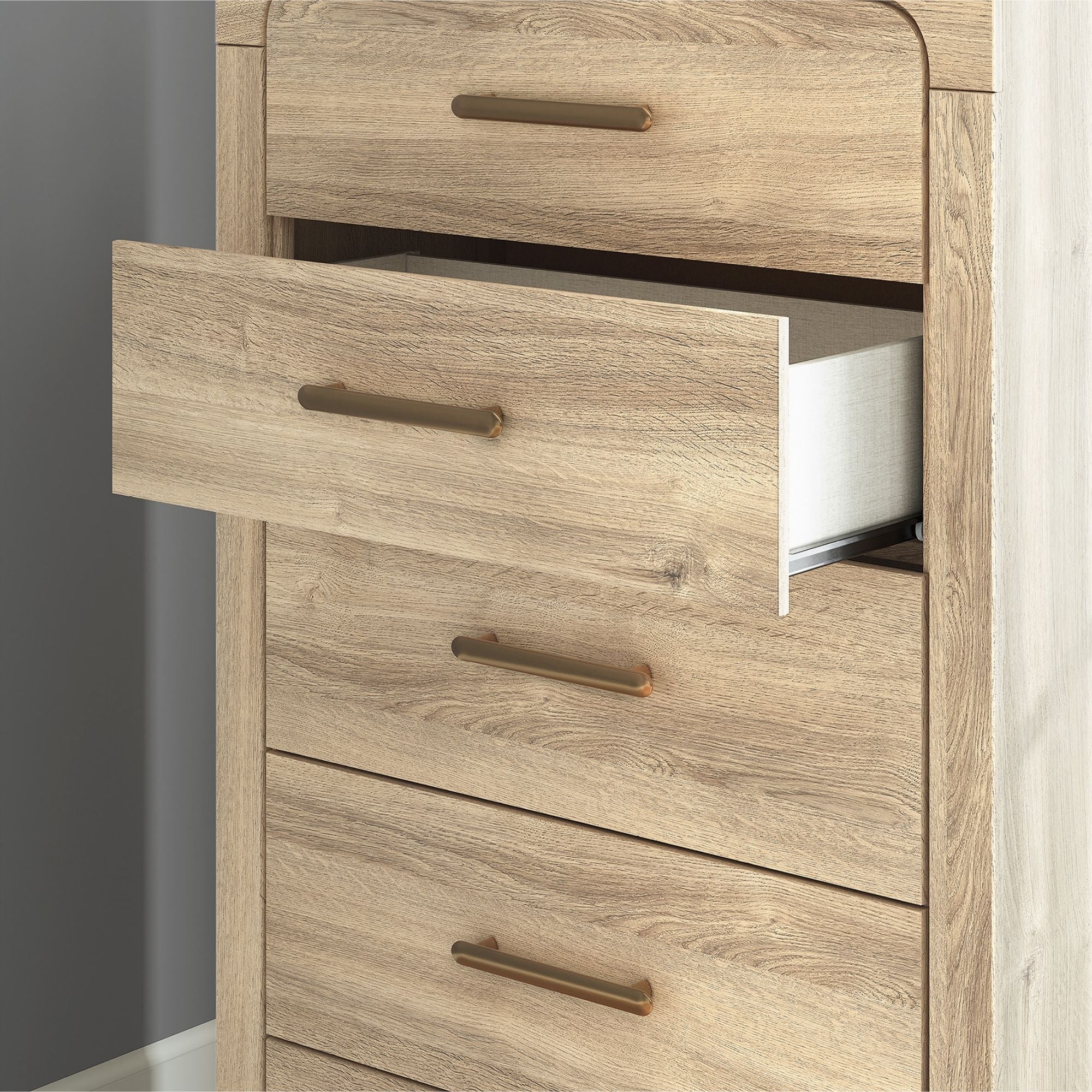 Tan Kinlanni five-drawer chest from Signature Ashley, featuring a sturdy wooden design and sleek drawer handles.