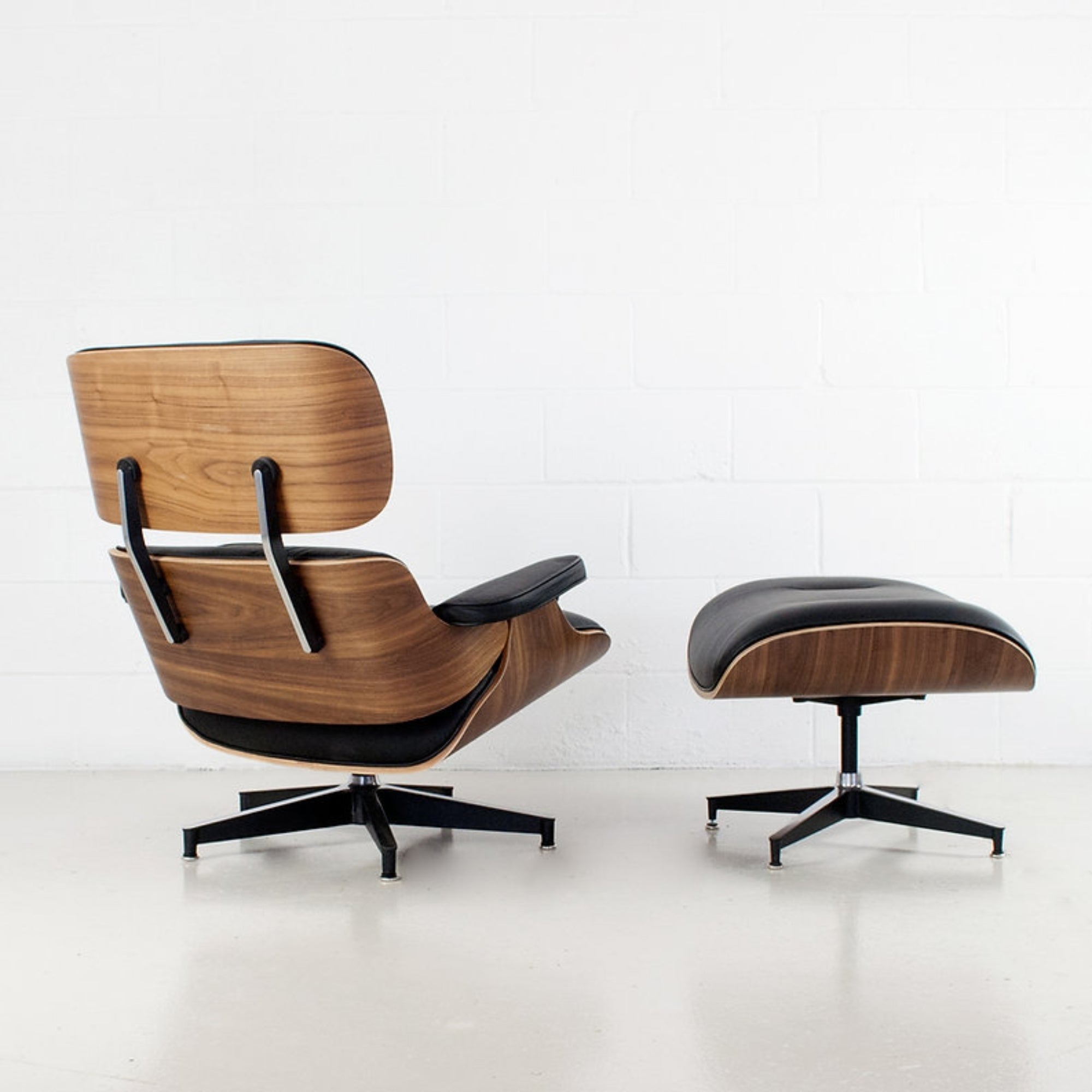 Elegant Charles swivel lounge chair and ottoman in top grain leather by Elite Living, showcasing plush seating and classic design.