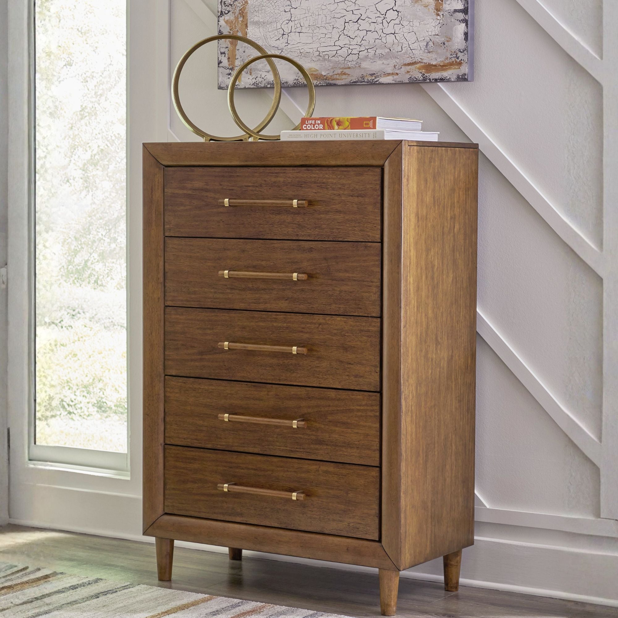 Signature Ashley Lyncott five drawer chest showing a modern wooden bedroom storage unit with five spacious drawers.