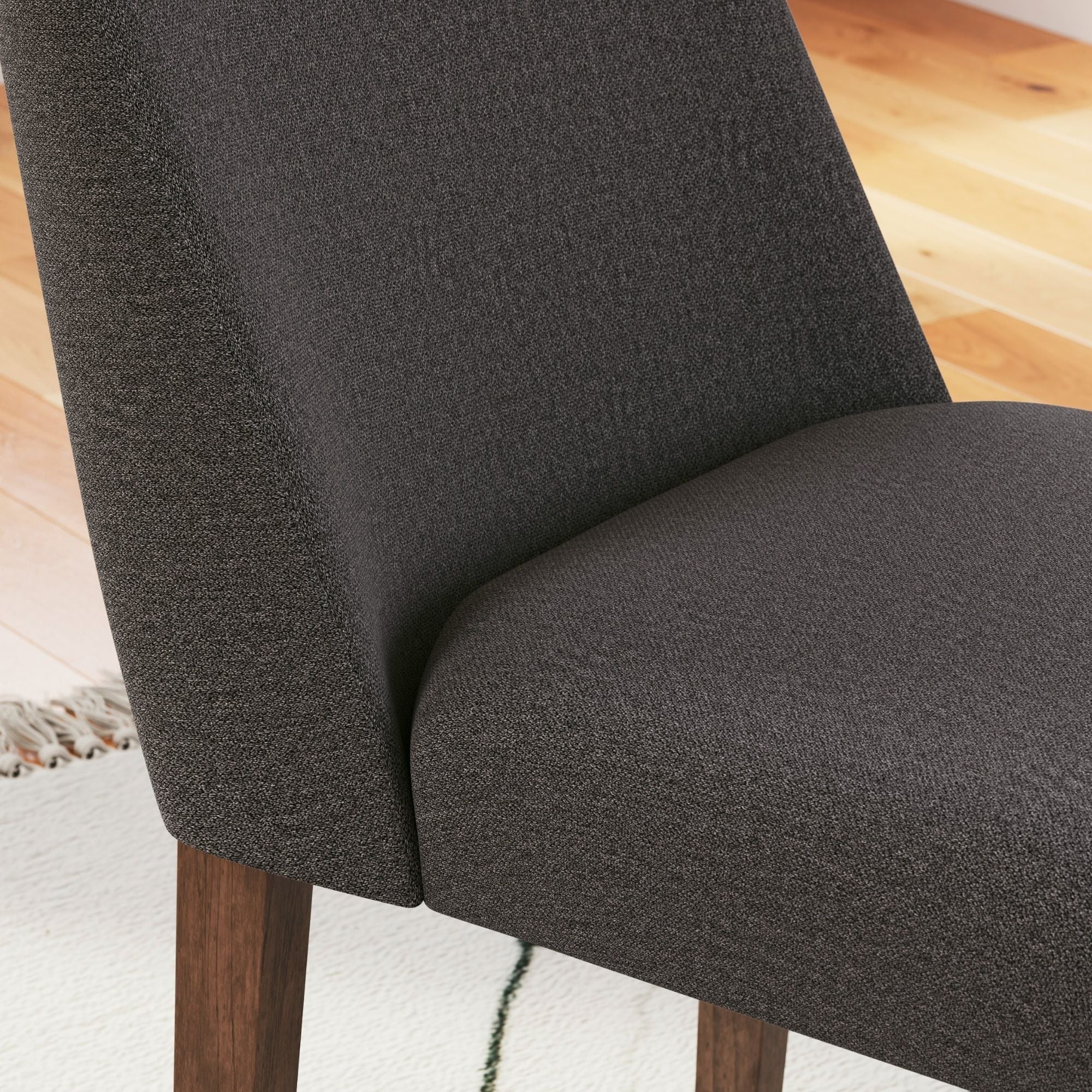 Signature Ashley Lyncott dining room set with charcoal upholstered side chairs, showcasing a modern design and comfortable seating.