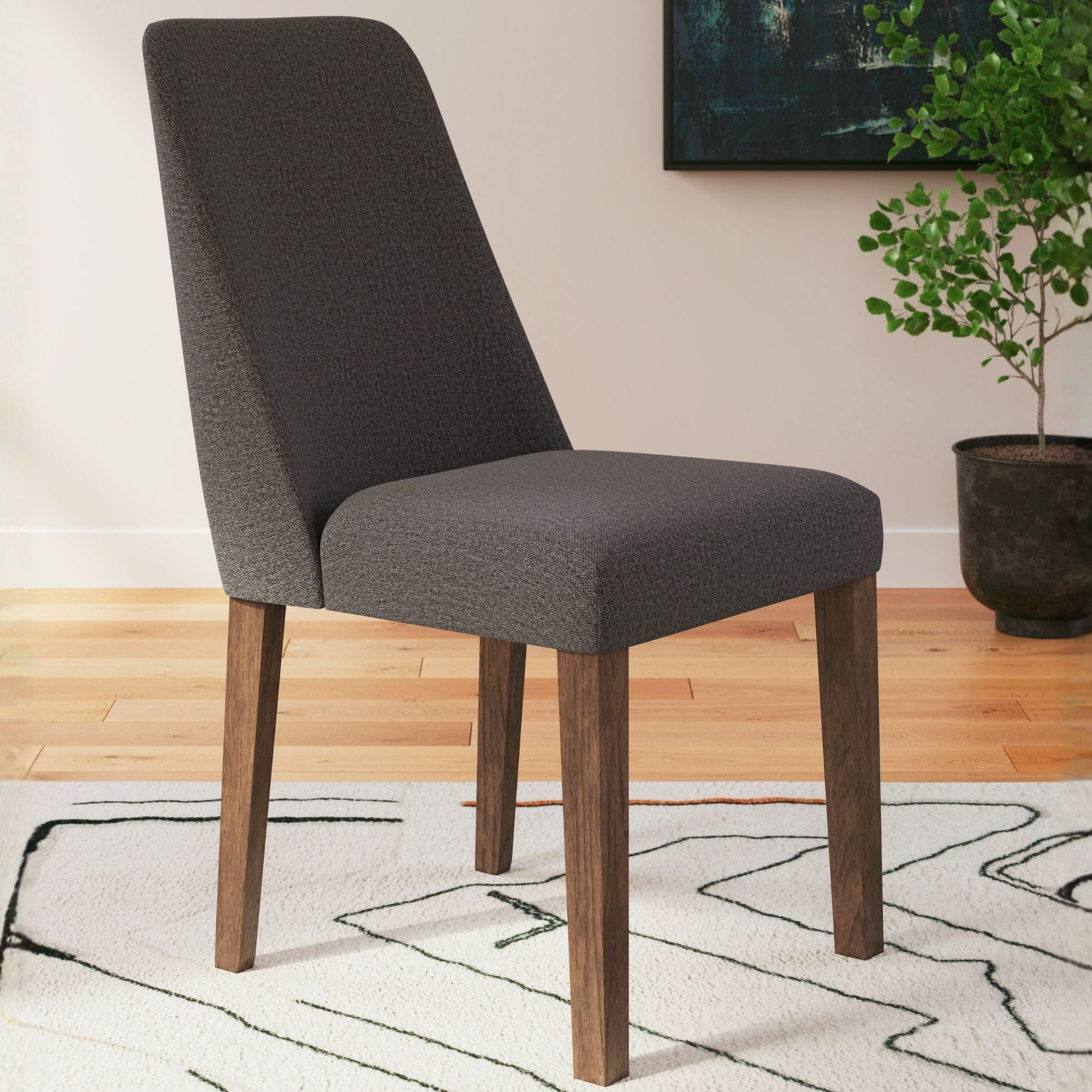 Set of two charcoal upholstered Lyncott dining UPH side chairs by Signature Ashley with sleek modern design.