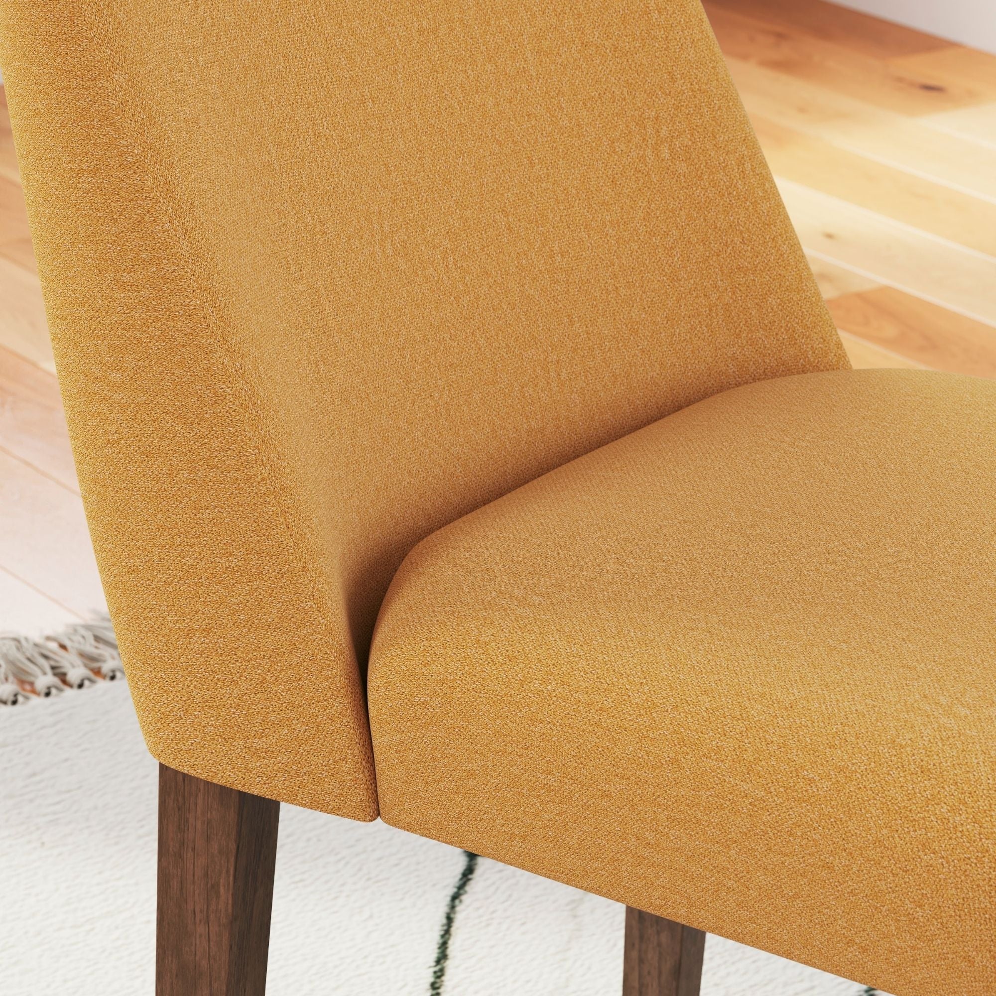Lyncott Collection dining room set with mustard upholstered side chairs by Signature Ashley, featuring a modern dining table and matching chairs.